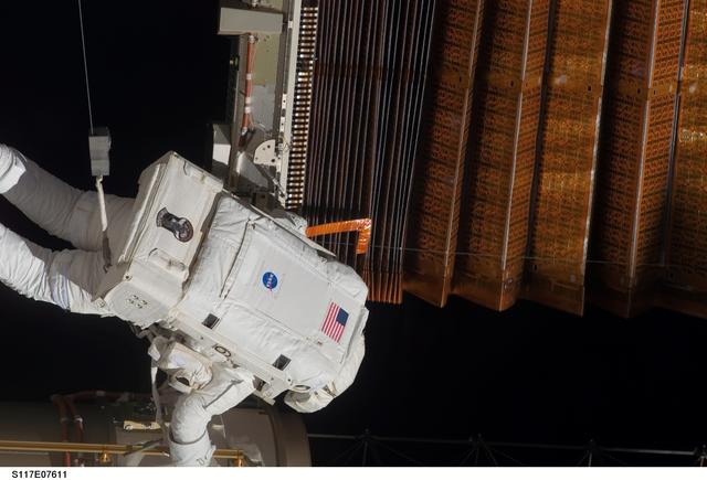 NASA image: Olivas at the P6 Truss STBD 2B SAW during retract operations on EVA 3