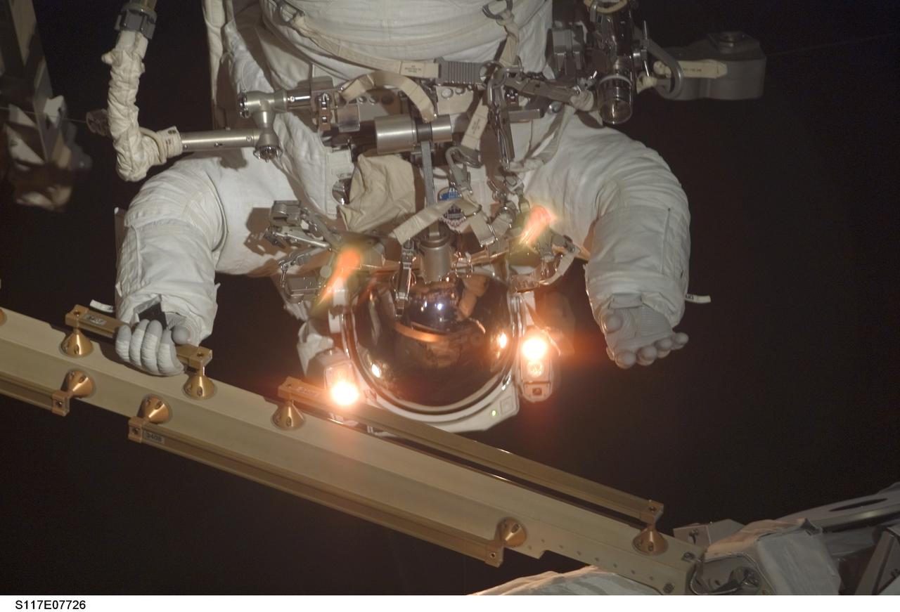 S117-E-07726 (17 June 2007) --- Astronaut Patrick Forrester, STS-117 mission specialist, participates in the mission's fourth and final session of extravehicular activity (EVA), as construction continues on the International Space Station. Among other tasks, Forrester and astronaut Steven Swanson (out of frame), mission specialist, continued activation of the station's new starboard 3 and 4 (S3/S4) truss segment; checked out the Drive Lock Assembly 2, one of two mechanisms that will drive rotation of the S3/S4 Truss Solar Alpha Rotary Joint (SARJ); and removed the final launch restraints on the SARJ.