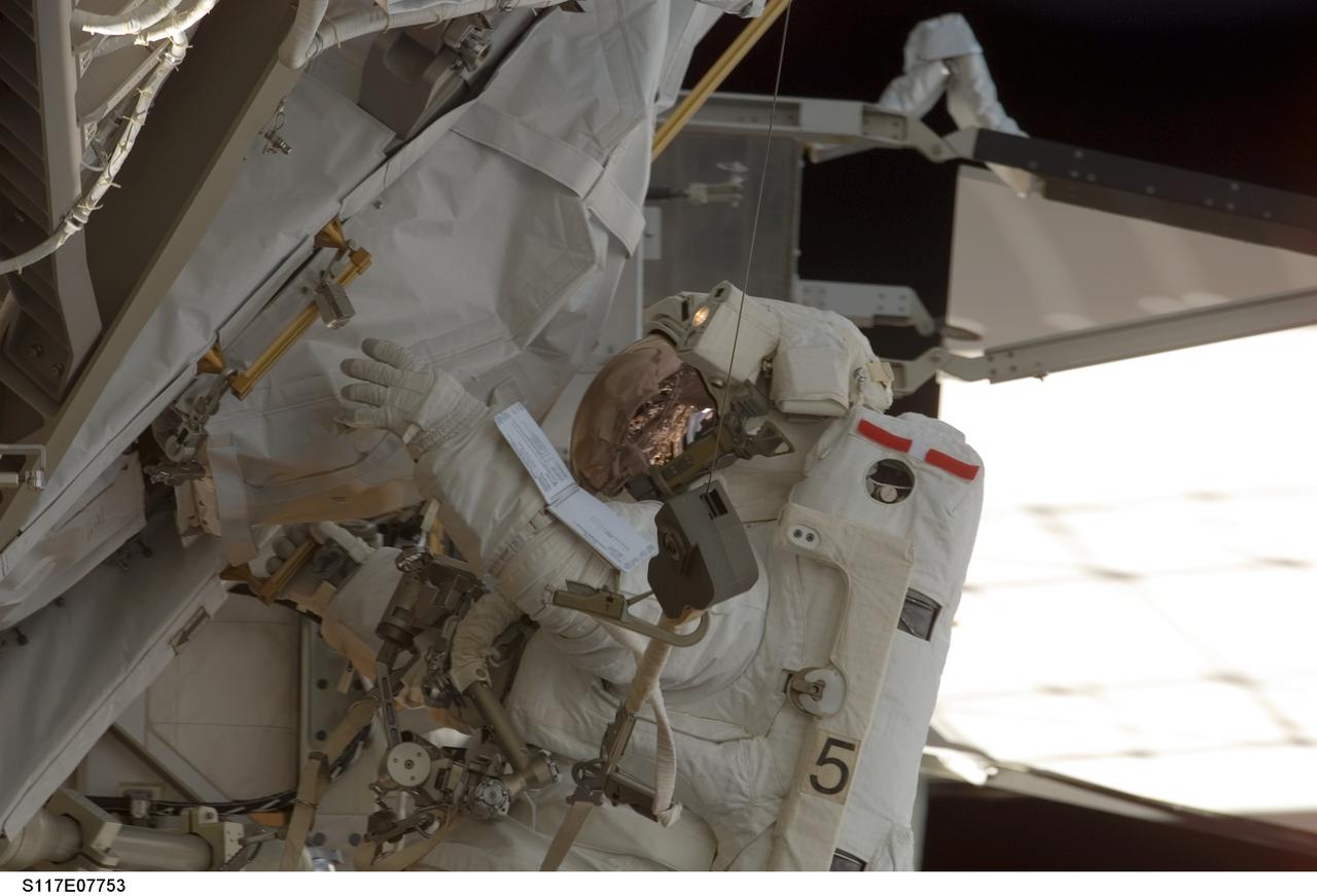 S117-E-07753 (17 June 2007) --- Astronaut Patrick Forrester, STS-117 mission specialist, participates in the mission's fourth and final session of extravehicular activity (EVA), as construction continues on the International Space Station. Among other tasks, Forrester and astronaut Steven Swanson (out of frame), mission specialist, continued activation of the station's new starboard 3 and 4 (S3/S4) truss segment; checked out the Drive Lock Assembly 2, one of two mechanisms that will drive rotation of the S3/S4 Truss Solar Alpha Rotary Joint (SARJ); and removed the final launch restraints on the SARJ.