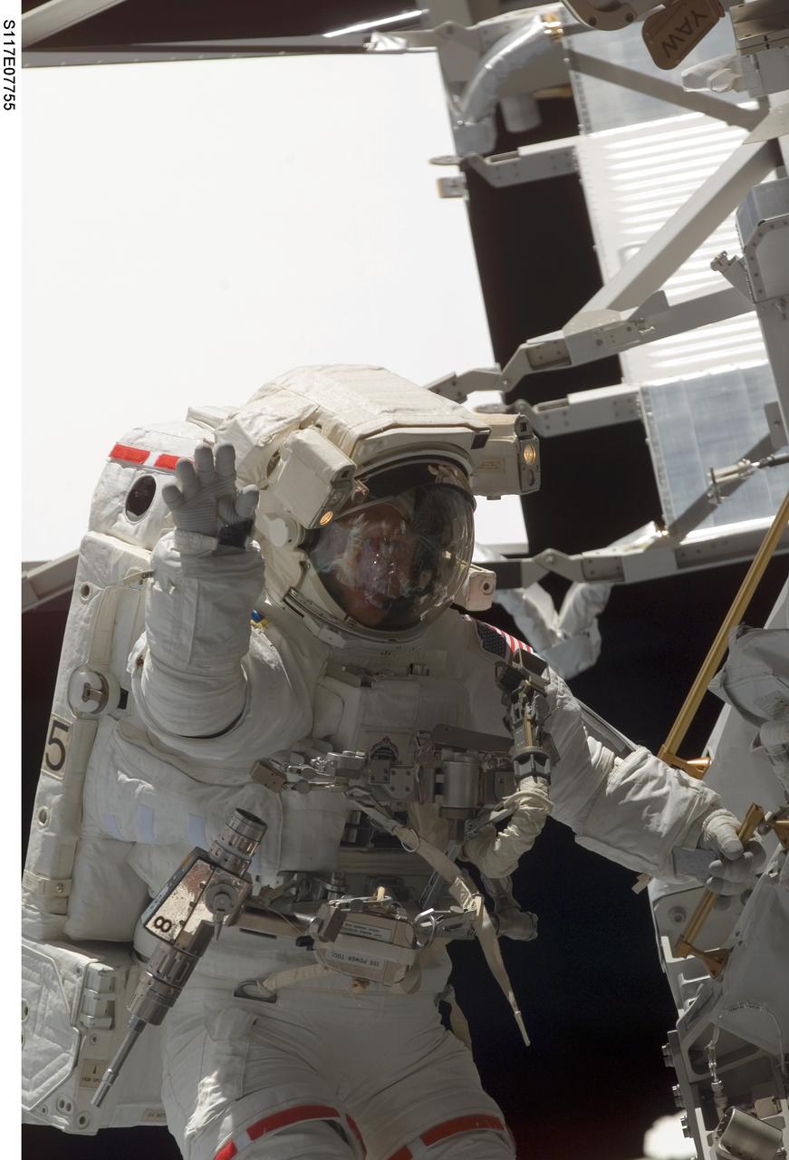 S117-E-07755 (17 June 2007) --- Astronaut Patrick Forrester, STS-117 mission specialist, participates in the mission's fourth and final session of extravehicular activity (EVA), as construction continues on the International Space Station. Among other tasks, Forrester and astronaut Steven Swanson (out of frame), mission specialist, continued activation of the station's new starboard 3 and 4 (S3/S4) truss segment; checked out the Drive Lock Assembly 2, one of two mechanisms that will drive rotation of the S3/S4 Truss Solar Alpha Rotary Joint (SARJ); and removed the final launch restraints on the SARJ.