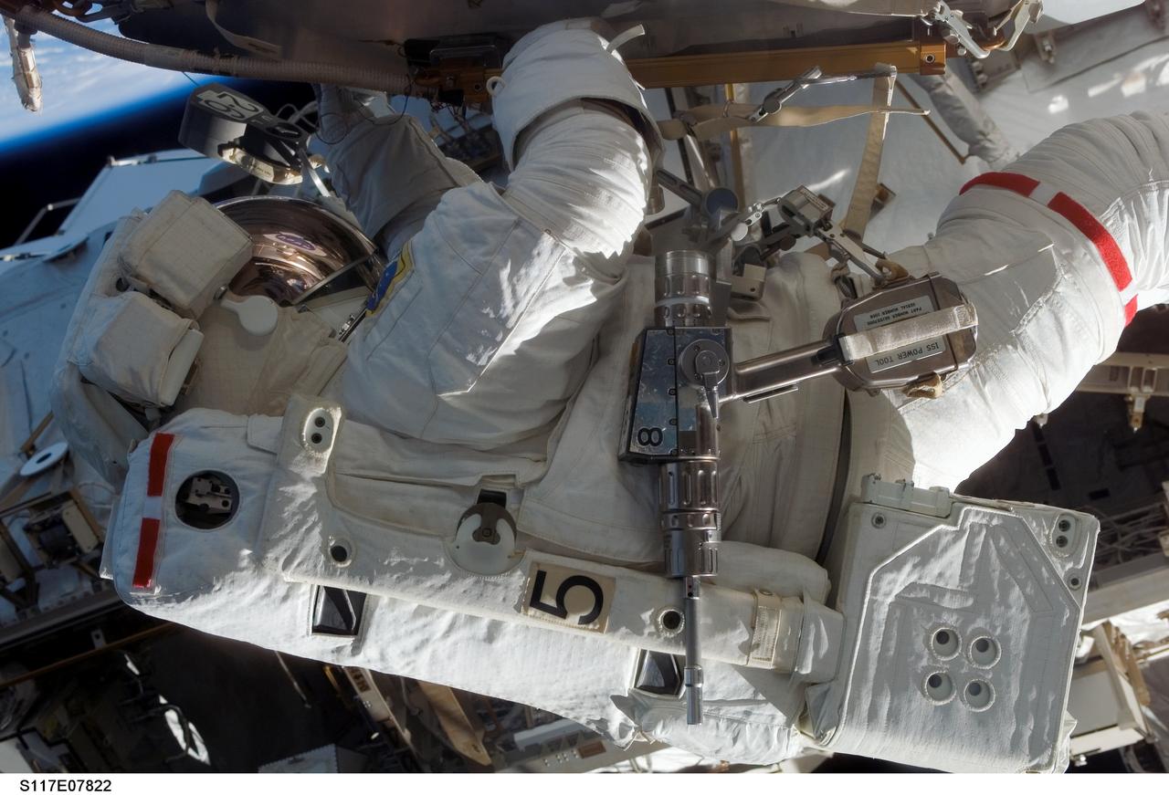 S117-E-07822 (17 June 2007) --- Astronaut Patrick Forrester, STS-117 mission specialist, participates in the mission's fourth and final session of extravehicular activity (EVA), as construction continues on the International Space Station. Among other tasks, Forrester and astronaut Steven Swanson (out of frame), mission specialist, continued activation of the station's new starboard 3 and 4 (S3/S4) truss segment; checked out the Drive Lock Assembly 2, one of two mechanisms that will drive rotation of the S3/S4 Truss Solar Alpha Rotary Joint (SARJ); and removed the final launch restraints on the SARJ.