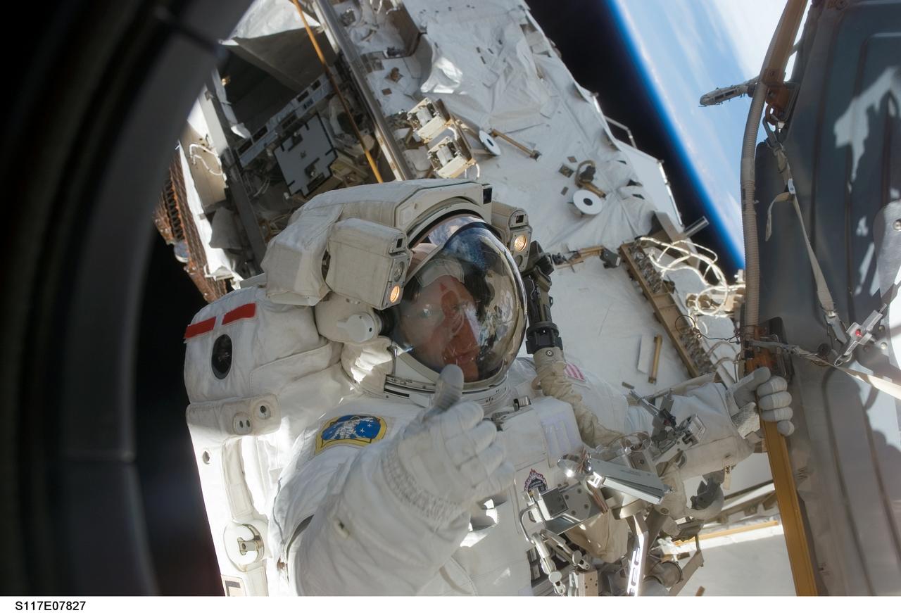 S117-E-07827 (17 June 2007) --- Astronaut Patrick Forrester, STS-117 mission specialist, participates in the mission's fourth and final session of extravehicular activity (EVA), as construction continues on the International Space Station. Among other tasks, Forrester and astronaut Steven Swanson (out of frame), mission specialist, continued activation of the station's new starboard 3 and 4 (S3/S4) truss segment; checked out the Drive Lock Assembly 2, one of two mechanisms that will drive rotation of the S3/S4 Truss Solar Alpha Rotary Joint (SARJ); and removed the final launch restraints on the SARJ.