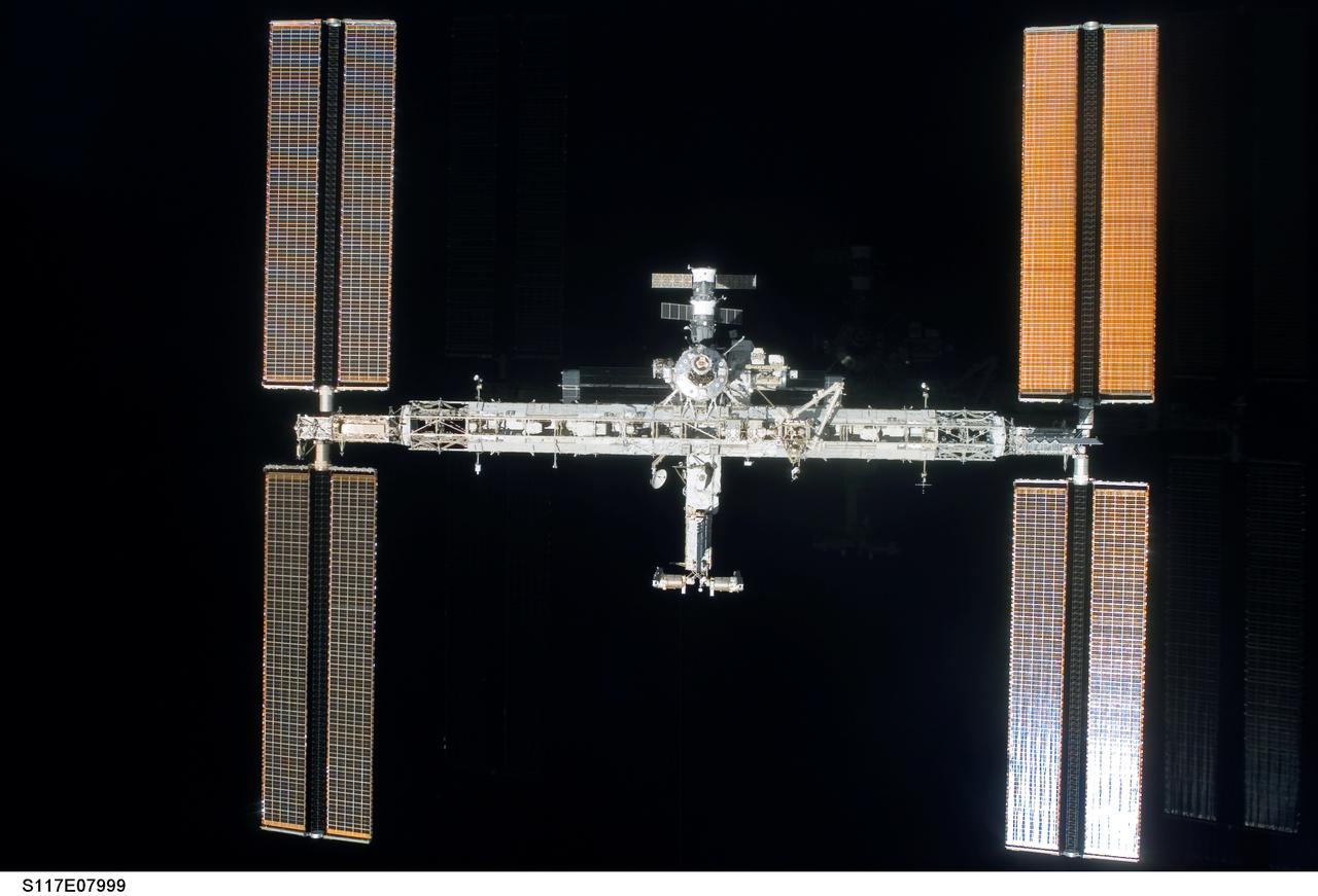 S117-E-07999 (19 June 2007) --- Backdropped by the blackness of space, the International Space Station moves away from the Space Shuttle Atlantis. Earlier the STS-117 and Expedition 15 crews concluded about eight days of cooperative work onboard the shuttle and station. Undocking of the two spacecraft occurred at 9:42 a.m. (CDT) on June 19, 2007. Astronaut Lee Archambault, STS-117 pilot, was at the controls for the departure and fly-around, which gave Atlantis' crew a look at the station's new expanded configuration.