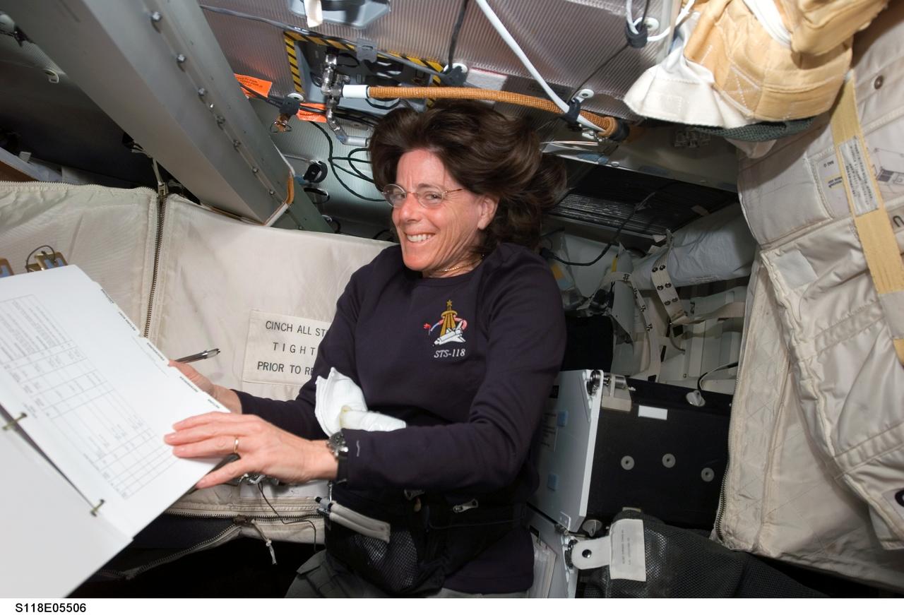 S118-E-05506 (9 Aug. 2007) --- Astronaut Barbara R. Morgan, STS-118 mission specialist, smiles for the camera while working on the middeck of Space Shuttle Endeavour during flight day two activities.