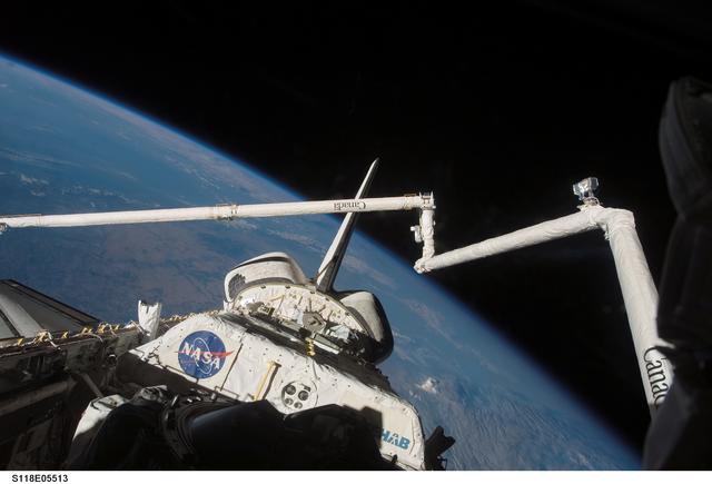 NASA image: View of the Payload Bay,Vertical Stabilizer,and RMS/OBSS taken during STS-118