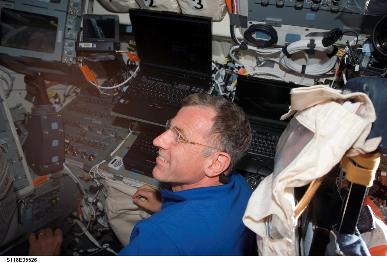 S118-E-05526 (9 Aug. 2007) --- Astronaut Dave Williams, STS-118 mission specialist representing the Canadian Space Agency, photographed on the aft flight deck of Space Shuttle Endeavour during flight day two activities.