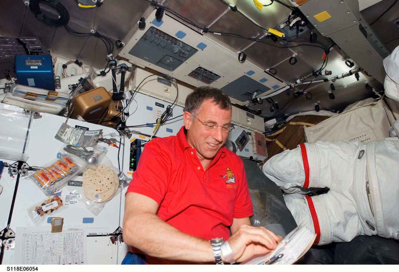 S118-E-06054 (10 Aug. 2007) --- Astronaut Dave Williams, mission specialist representing the Canadian Space Agency, not long before going aboard the International Space Station when this middeck picture was taken on Aug. 10, may be thinking about his upcoming spacewalk, scheduled for Aug. 11.