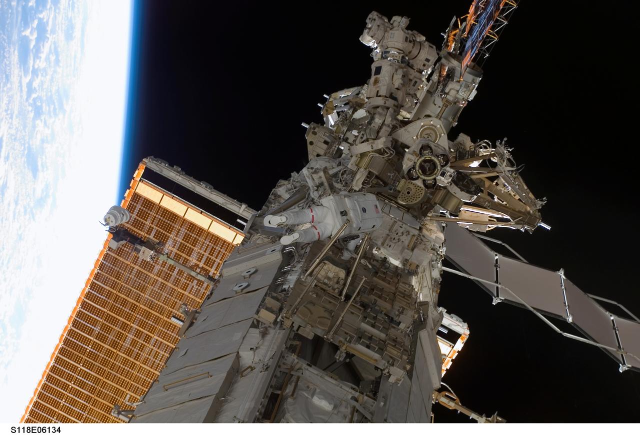 S118-E-06134 (11 Aug. 2007) --- Astronauts Rick Mastracchio and Canadian Space Agency's Dave Williams (out of frame), both STS-118 mission specialists, participate in the mission's first planned session of extravehicular activity (EVA), as construction continues on the International Space Station. During the 6-hour, 17-minute spacewalk Mastracchio and Williams attached the Starboard 5 (S5) segment of the station's truss, retracted the forward heat-rejecting radiator from the station's Port 6 (P6) truss, and performed several get-ahead tasks.