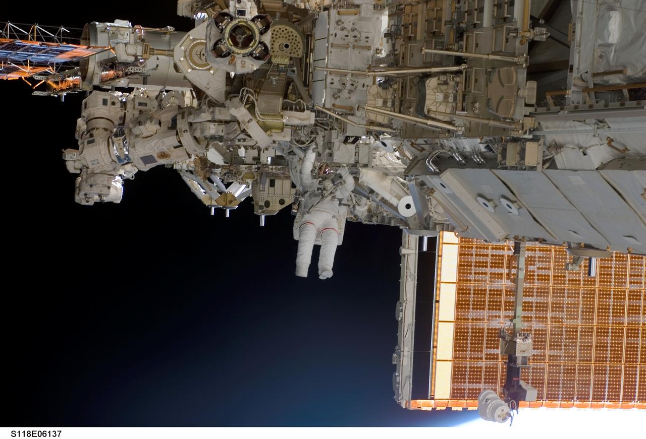 S118-E-06137 (11 Aug. 2007) --- Astronauts Rick Mastracchio and Canadian Space Agency's Dave Williams (out of frame), both STS-118 mission specialists, participate in the mission's first planned session of extravehicular activity (EVA), as construction continues on the International Space Station. During the 6-hour, 17-minute spacewalk Mastracchio and Williams attached the Starboard 5 (S5) segment of the station's truss, retracted the forward heat-rejecting radiator from the station's Port 6 (P6) truss, and performed several get-ahead tasks.