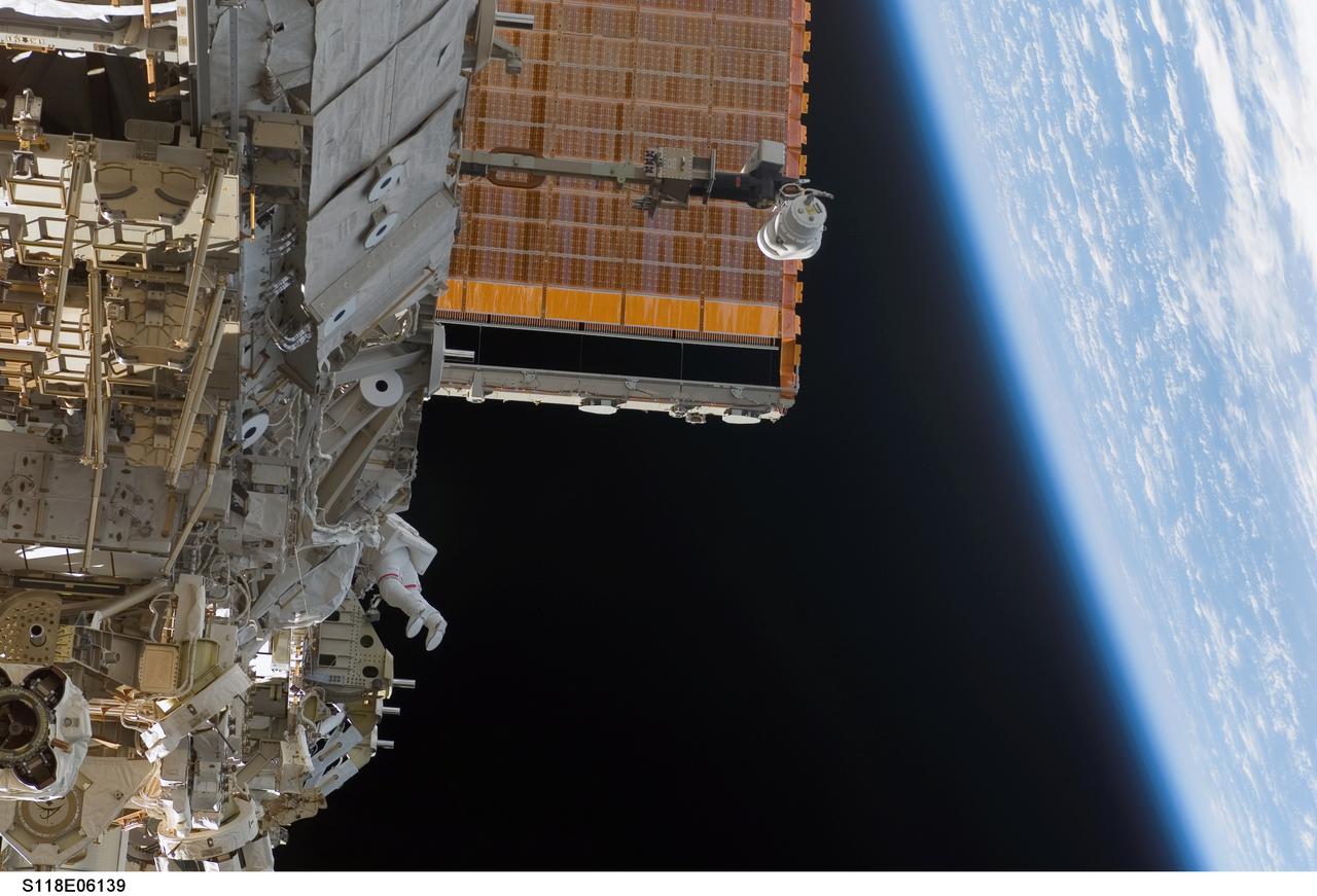 S118-E-06139 (11 Aug. 2007) --- Astronauts Rick Mastracchio and Canadian Space Agency's Dave Williams (out of frame), both STS-118 mission specialists, participate in the mission's first planned session of extravehicular activity (EVA), as construction continues on the International Space Station. During the 6-hour, 17-minute spacewalk Mastracchio and Williams attached the Starboard 5 (S5) segment of the station's truss, retracted the forward heat-rejecting radiator from the station's Port 6 (P6) truss, and performed several get-ahead tasks.