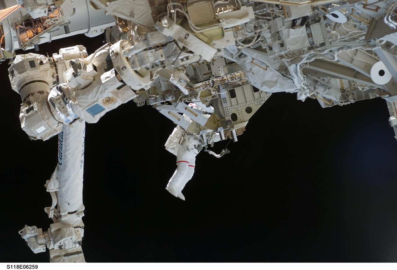 S118-E-06259 (11 Aug. 2007) --- Astronauts Rick Mastracchio and Canadian Space Agency's Dave Williams (out of frame), both STS-118 mission specialists, participate in the mission's first planned session of extravehicular activity (EVA), as construction continues on the International Space Station. During the 6-hour, 17-minute spacewalk Mastracchio and Williams attached the Starboard 5 (S5) segment of the station's truss, retracted the forward heat-rejecting radiator from the station's Port 6 (P6) truss, and performed several get-ahead tasks.