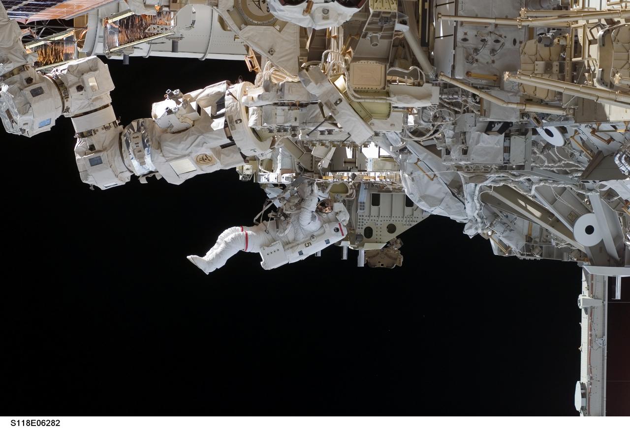 S118-E-06282 (11 Aug. 2007) --- Astronauts Rick Mastracchio and Canadian Space Agency's Dave Williams (out of frame), both STS-118 mission specialists, participate in the mission's first planned session of extravehicular activity (EVA), as construction continues on the International Space Station. During the 6-hour, 17-minute spacewalk Mastracchio and Williams attached the Starboard 5 (S5) segment of the station's truss, retracted the forward heat-rejecting radiator from the station's Port 6 (P6) truss, and performed several get-ahead tasks.