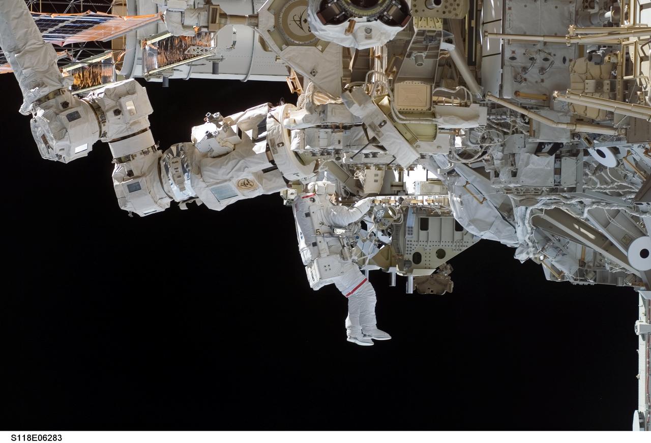 S118-E-06283 (11 Aug. 2007) --- Astronauts Rick Mastracchio and Canadian Space Agency's Dave Williams (out of frame), both STS-118 mission specialists, participate in the mission's first planned session of extravehicular activity (EVA), as construction continues on the International Space Station. During the 6-hour, 17-minute spacewalk Mastracchio and Williams attached the Starboard 5 (S5) segment of the station's truss, retracted the forward heat-rejecting radiator from the station's Port 6 (P6) truss, and performed several get-ahead tasks.