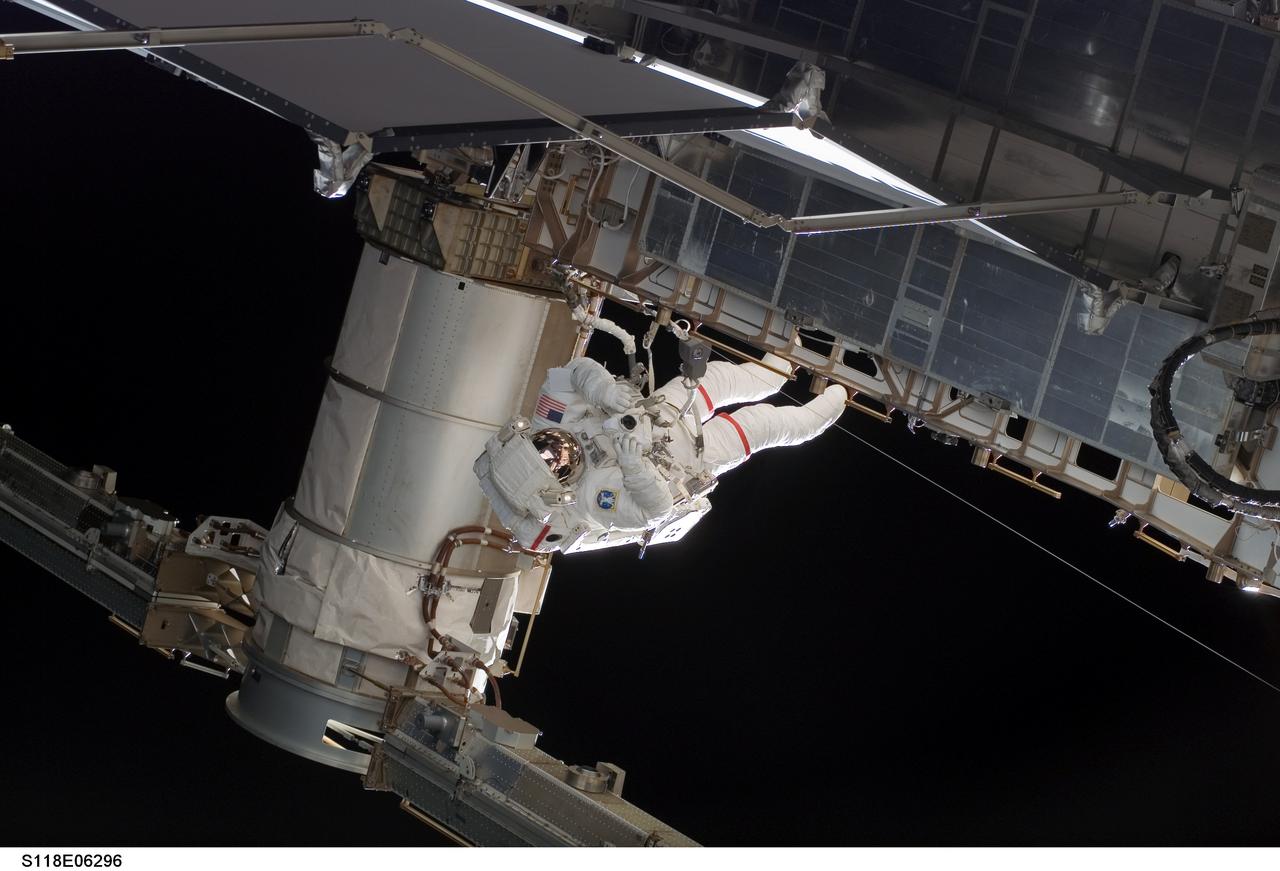 S118-E-06296 (11 Aug. 2007) --- Astronauts Rick Mastracchio and Canadian Space Agency's Dave Williams (out of frame), both STS-118 mission specialists, participate in the mission's first planned session of extravehicular activity (EVA), as construction continues on the International Space Station. During the 6-hour, 17-minute spacewalk Mastracchio and Williams attached the Starboard 5 (S5) segment of the station's truss, retracted the forward heat-rejecting radiator from the station's Port 6 (P6) truss, and performed several get-ahead tasks.