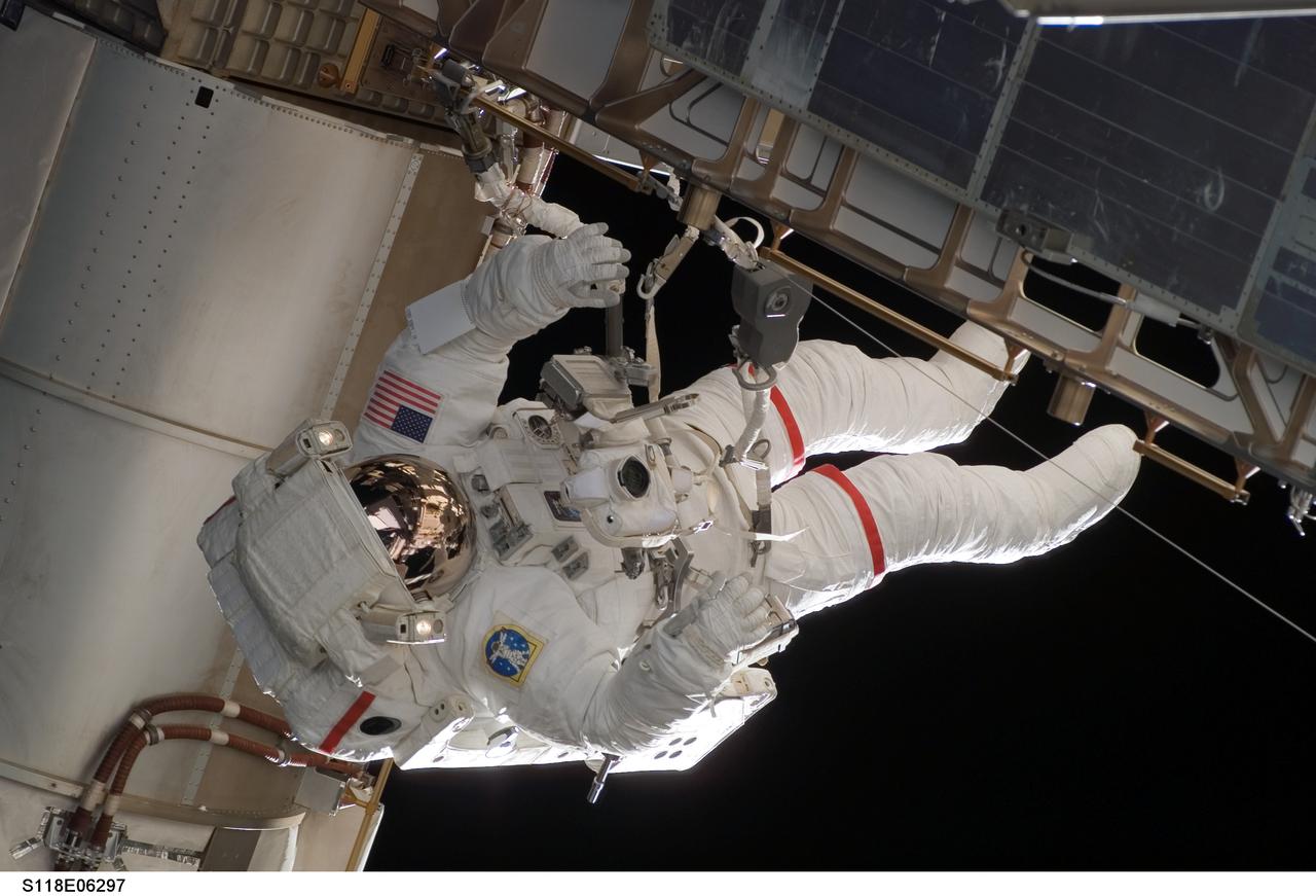 S118-E-06297 (11 Aug. 2007) --- Astronauts Rick Mastracchio and Canadian Space Agency's Dave Williams (out of frame), both STS-118 mission specialists, participate in the mission's first planned session of extravehicular activity (EVA), as construction continues on the International Space Station. During the 6-hour, 17-minute spacewalk Mastracchio and Williams attached the Starboard 5 (S5) segment of the station's truss, retracted the forward heat-rejecting radiator from the station's Port 6 (P6) truss, and performed several get-ahead tasks.