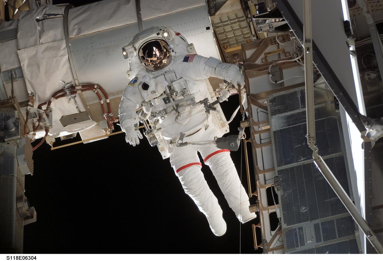 S118-E-06304 (11 Aug. 2007) --- Astronauts Rick Mastracchio and Canadian Space Agency's Dave Williams (out of frame), both STS-118 mission specialists, participate in the mission's first planned session of extravehicular activity (EVA), as construction continues on the International Space Station. During the 6-hour, 17-minute spacewalk Mastracchio and Williams attached the Starboard 5 (S5) segment of the station's truss, retracted the forward heat-rejecting radiator from the station's Port 6 (P6) truss, and performed several get-ahead tasks.