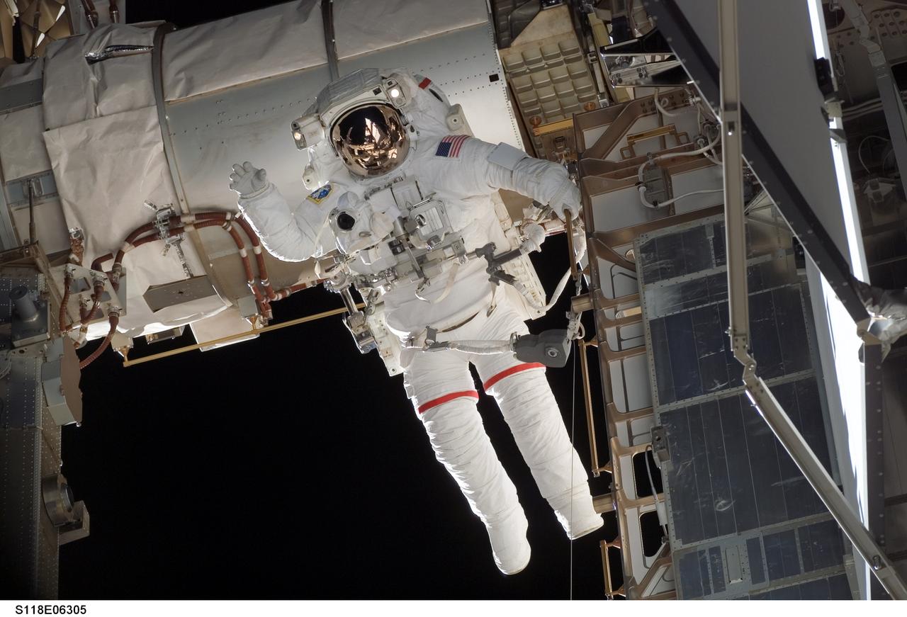 S118-E-06305 (11 Aug. 2007) --- Astronauts Rick Mastracchio and Canadian Space Agency's Dave Williams (out of frame), both STS-118 mission specialists, participate in the mission's first planned session of extravehicular activity (EVA), as construction continues on the International Space Station. During the 6-hour, 17-minute spacewalk Mastracchio and Williams attached the Starboard 5 (S5) segment of the station's truss, retracted the forward heat-rejecting radiator from the station's Port 6 (P6) truss, and performed several get-ahead tasks.