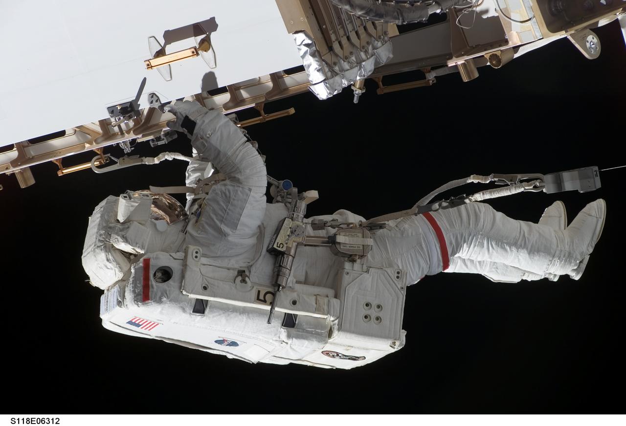 S118-E-06312 (11 Aug. 2007) --- Astronauts Rick Mastracchio and Canadian Space Agency's Dave Williams (out of frame), both STS-118 mission specialists, participate in the mission's first planned session of extravehicular activity (EVA), as construction continues on the International Space Station. During the 6-hour, 17-minute spacewalk Mastracchio and Williams attached the Starboard 5 (S5) segment of the station's truss, retracted the forward heat-rejecting radiator from the station's Port 6 (P6) truss, and performed several get-ahead tasks.