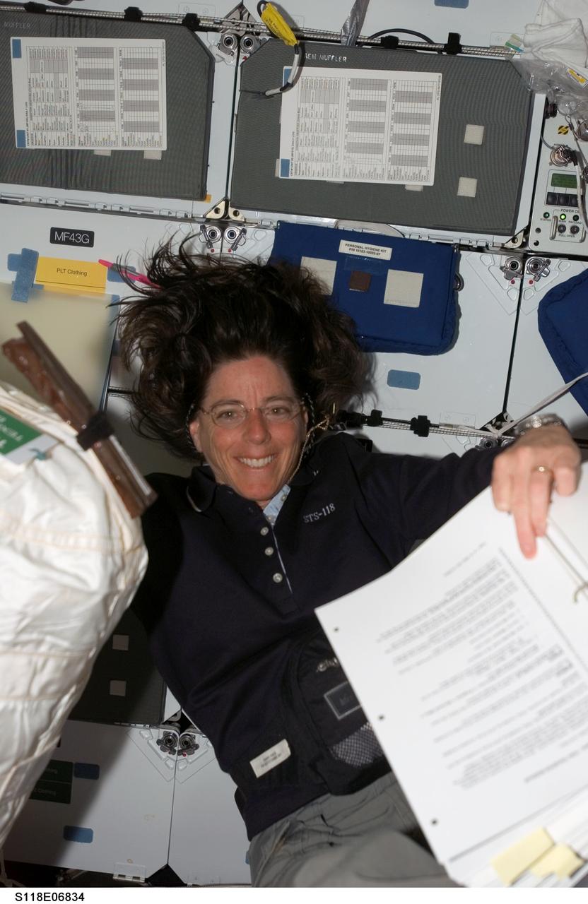 S118-E-06834 (11 Aug. 2007) --- Astronaut Barbara R. Morgan, STS-118 mission specialist, pauses for a photo while working on the middeck of Space Shuttle Endeavour while docked with the International Space Station during flight day four activities.