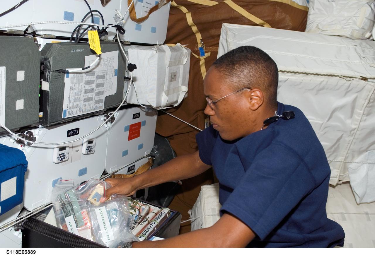 S118-E-06889 (12 Aug. 2007) --- Astronaut Alvin Drew, STS-118 mission specialist, works on the middeck of Space Shuttle Endeavour while docked with the International Space Station during flight day five activities.