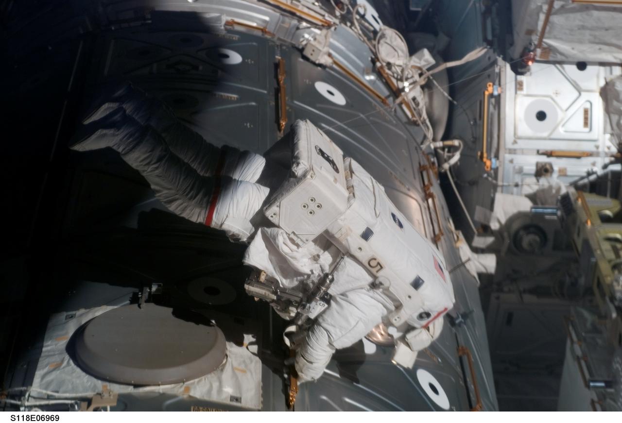 S118-E-06969 (13 Aug. 2007) --- Astronaut Rick Mastracchio, STS-118 mission specialist, participates in the mission's second planned session of extravehicular activity (EVA) as construction and maintenance continue on the International Space Station. During the 6-hour, 28-minute spacewalk, Mastracchio and astronaut Dave Williams (out of frame), mission specialist representing the Canadian Space Agency, removed a faulty control moment gyroscope (CMG-3) and installed a new CMG into the station's Z1 truss. The failed CMG will remain at its temporary stowage location on the station's exterior until it is returned to Earth on a later shuttle mission. The new gyroscope is one of four CMGs that are used to control the station's attitude in orbit.