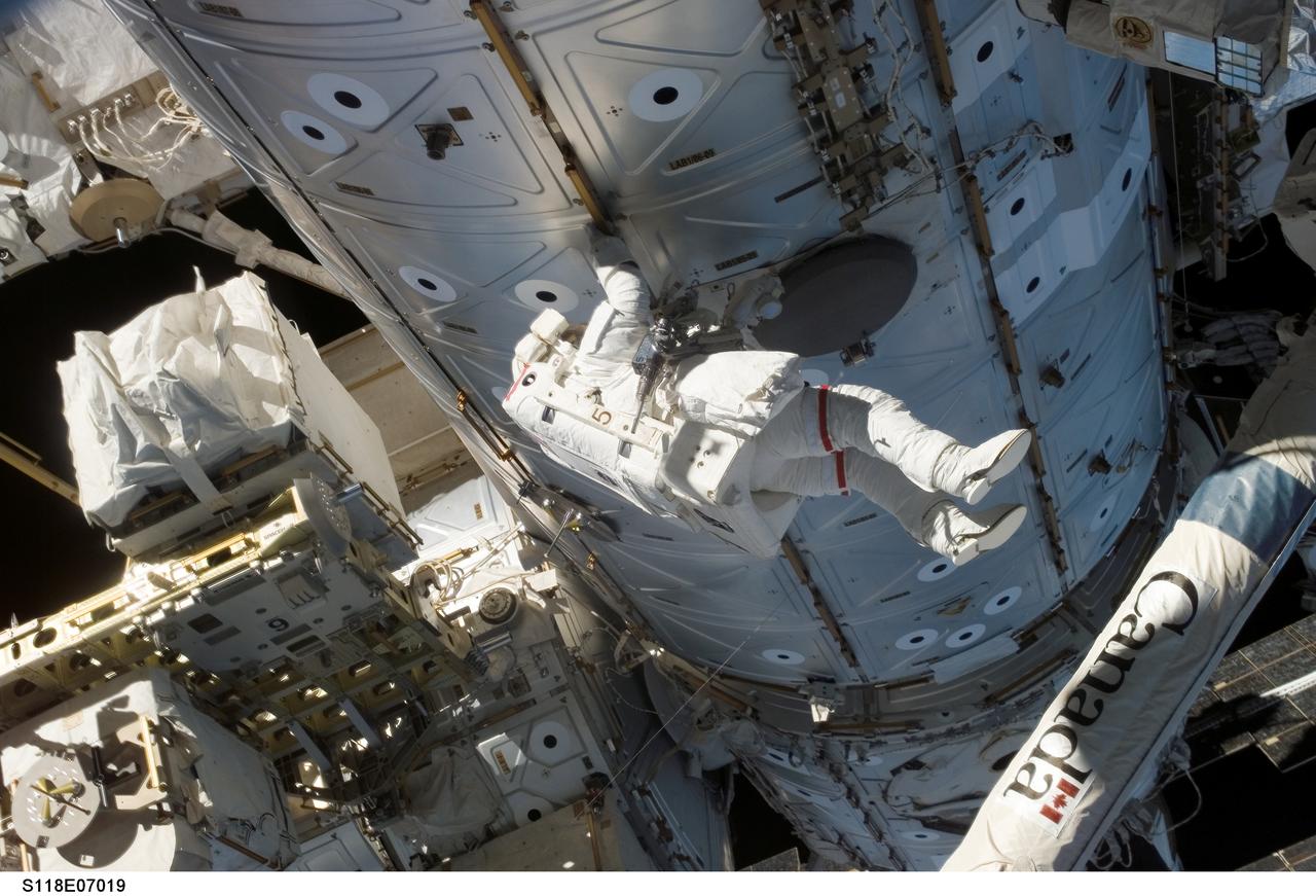 S118-E-07019 (13 Aug. 2007) --- Astronaut Rick Mastracchio, STS-118 mission specialist, participates in the mission's second planned session of extravehicular activity (EVA) as construction and maintenance continue on the International Space Station. During the 6-hour, 28-minute spacewalk, Mastracchio and astronaut Dave Williams (out of frame), mission specialist representing the Canadian Space Agency, removed a faulty control moment gyroscope (CMG-3) and installed a new CMG into the station's Z1 truss. The failed CMG will remain at its temporary stowage location on the station's exterior until it is returned to Earth on a later shuttle mission. The new gyroscope is one of four CMGs that are used to control the station's attitude in orbit.