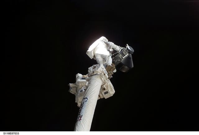 NASA image: View of MS Williams transporting the new CMG to the Z1 Truss during EVA 2