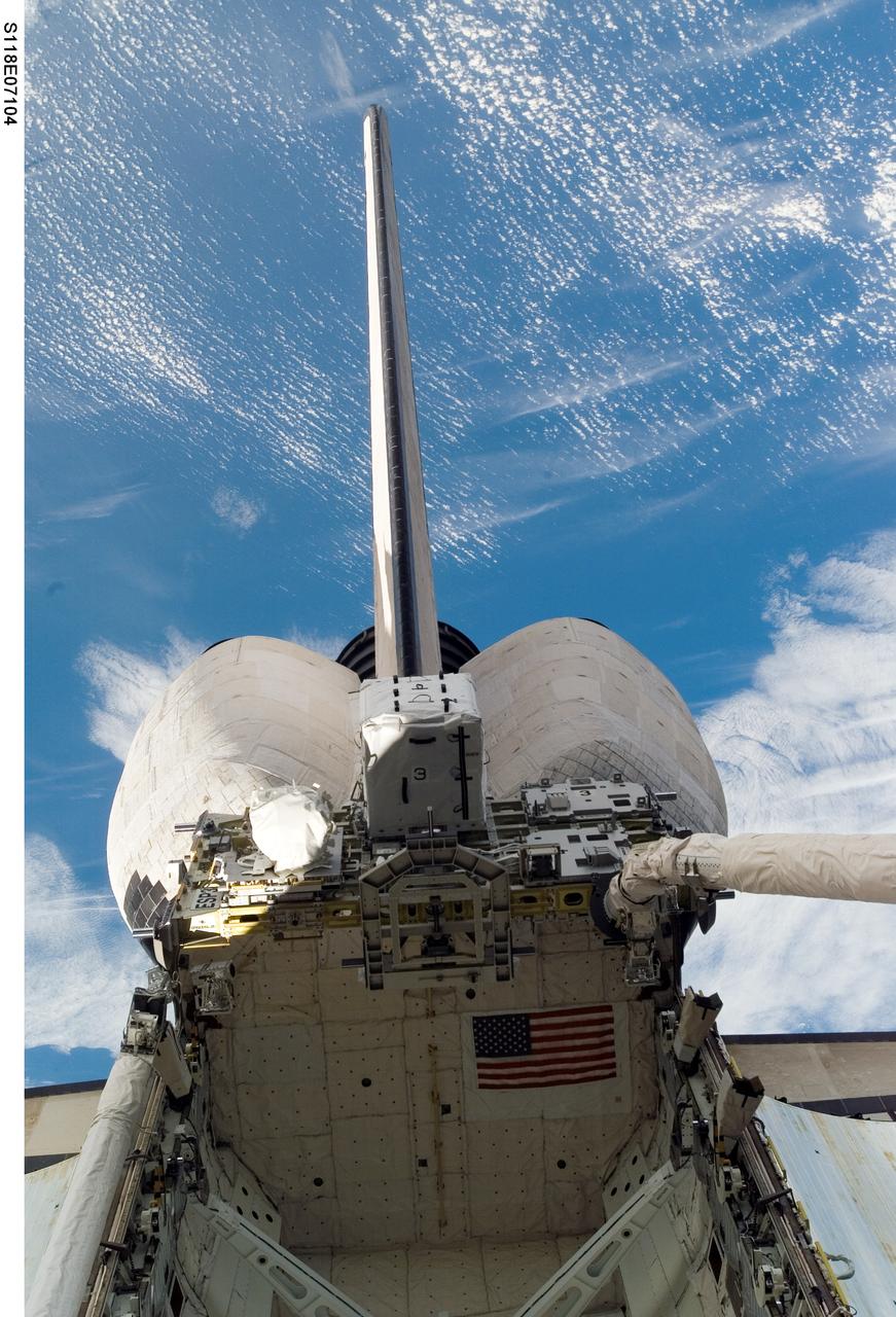 S118-E-07104 (14 Aug. 2007) --- An external stowage platform (ESP-3) is photographed in the payload bay of Space Shuttle Endeavour while docked with the International Space Station. Astronauts Tracy Caldwell and Barbara R. Morgan, both STS-118 mission specialists, were inside at Endeavour's controls as the shuttle's robotic arm (lower right) lifted the storage platform from the cargo bay to hand it over to the station's robotic arm, also known as Canadarm2. Astronauts Charlie Hobaugh, pilot, and Clay Anderson, Expedition 15 flight engineer, then used Canadarm2 to attach the 13-by-7-foot platform to the station's Port 3 truss.