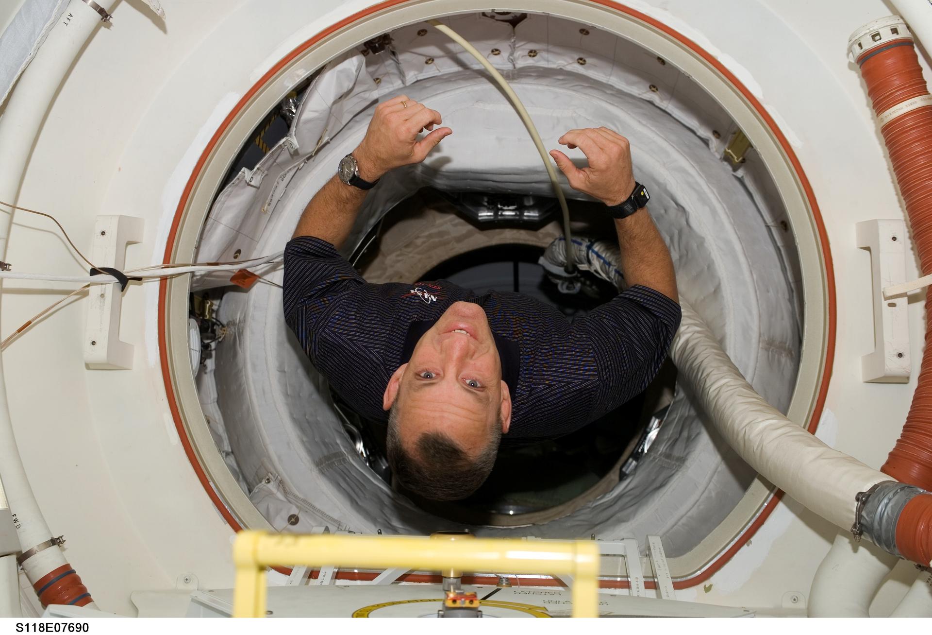 Hobaugh posing for a photo during STS-118/Expedition 15 Joint Operations