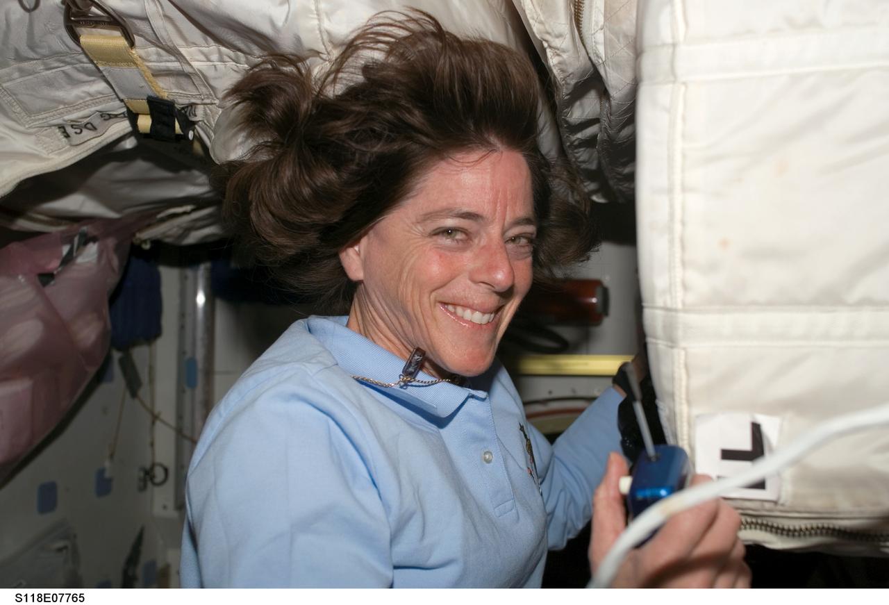 S118-E-07765 (17 Aug. 2007) --- Astronaut Barbara R. Morgan, mission specialist, finds herself surrounded by supplies in SPACEHAB, located in the cargo bay of the Space Shuttle Endeavour. Supply transfer was one of the main activities on the agenda Aug. 17 for the STS-118 crewmembers, who learned their anticipated departure from the International Space Station will come a day earlier due to possible weather issues back home.