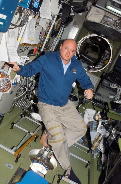 NASA image: View of Kelly posing for a photo in the SM during STS-118