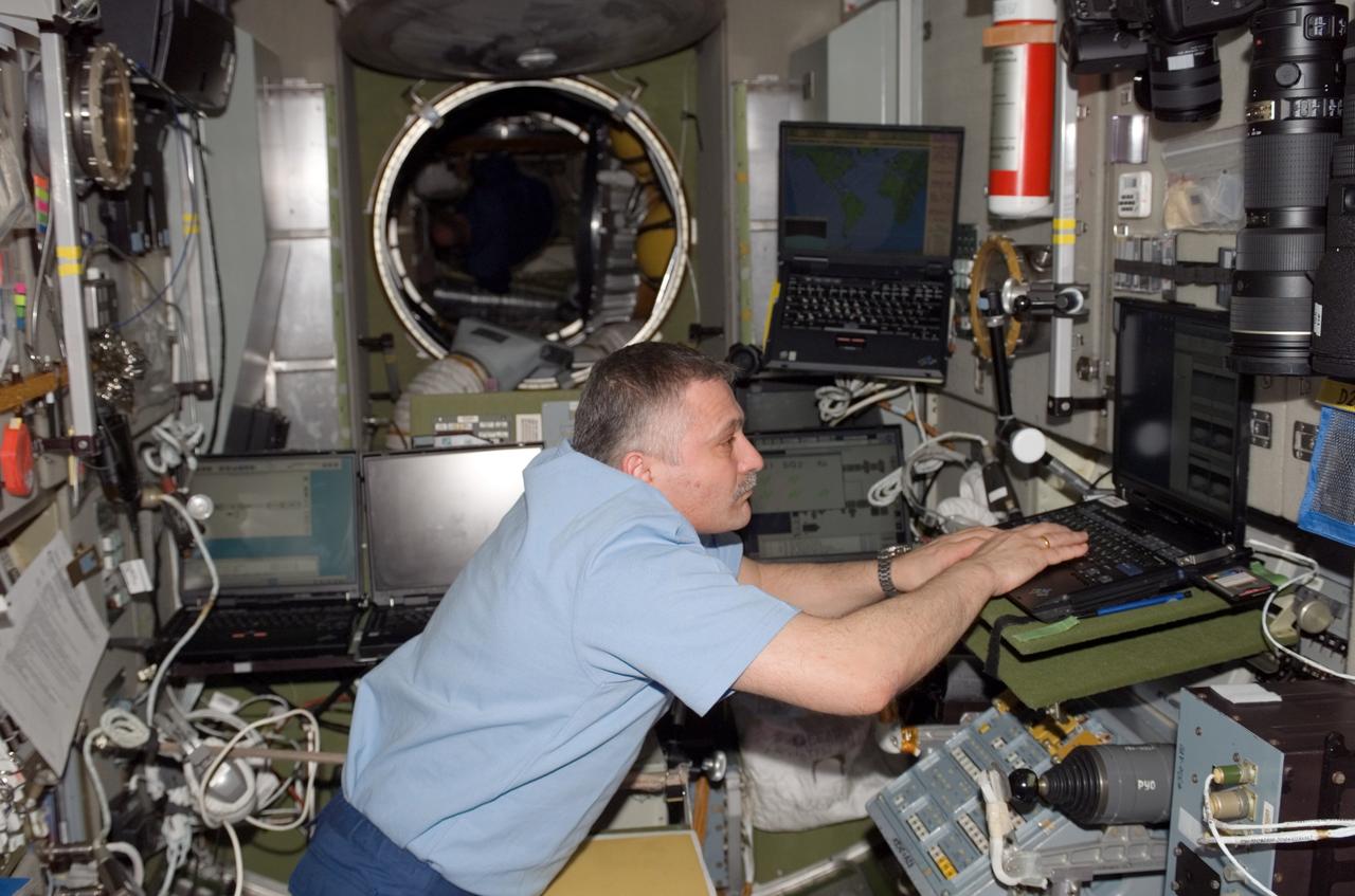 View of Yurchikhin working in the SM during STS-118/Expedition 15 Joint Operations