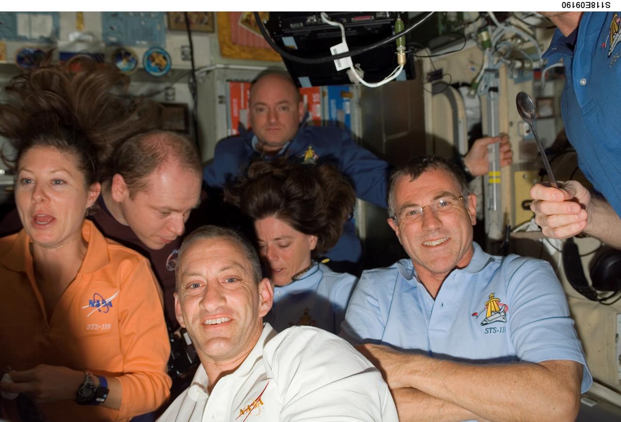 S118-E-09190 (18 Aug. 2007) --- The STS-118 and Expedition 15 crews gather for a farewell ceremony in the Zvezda Service Module of the International Space Station. Pictured are astronauts Tracy Caldwell (left), STS-118 mission specialist; Charlie Hobaugh (foreground), STS-118 pilot; Canadian Space Agency's Dave Williams (right), STS-118 mission specialist; cosmonaut Oleg V. Kotov, Expedition 15 flight engineer representing Russia's Federal Space Agency; astronaut Barbara R. Morgan, STS-118 mission specialist; and astronaut Scott Kelly (background), STS-118 commander. Hatches were closed between the station and Space Shuttle Endeavour at 4:10 p.m. on Aug. 18.