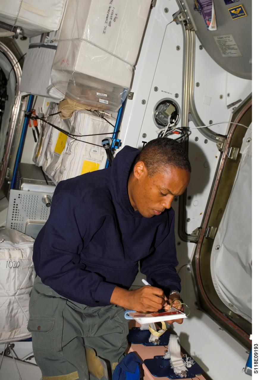 S118-E-09193 (18 Aug. 2007) --- Astronaut Alvin Drew, STS-118 mission specialist, works in the Unity node of the International Space Station while Space Shuttle Endeavour remains docked with the station.