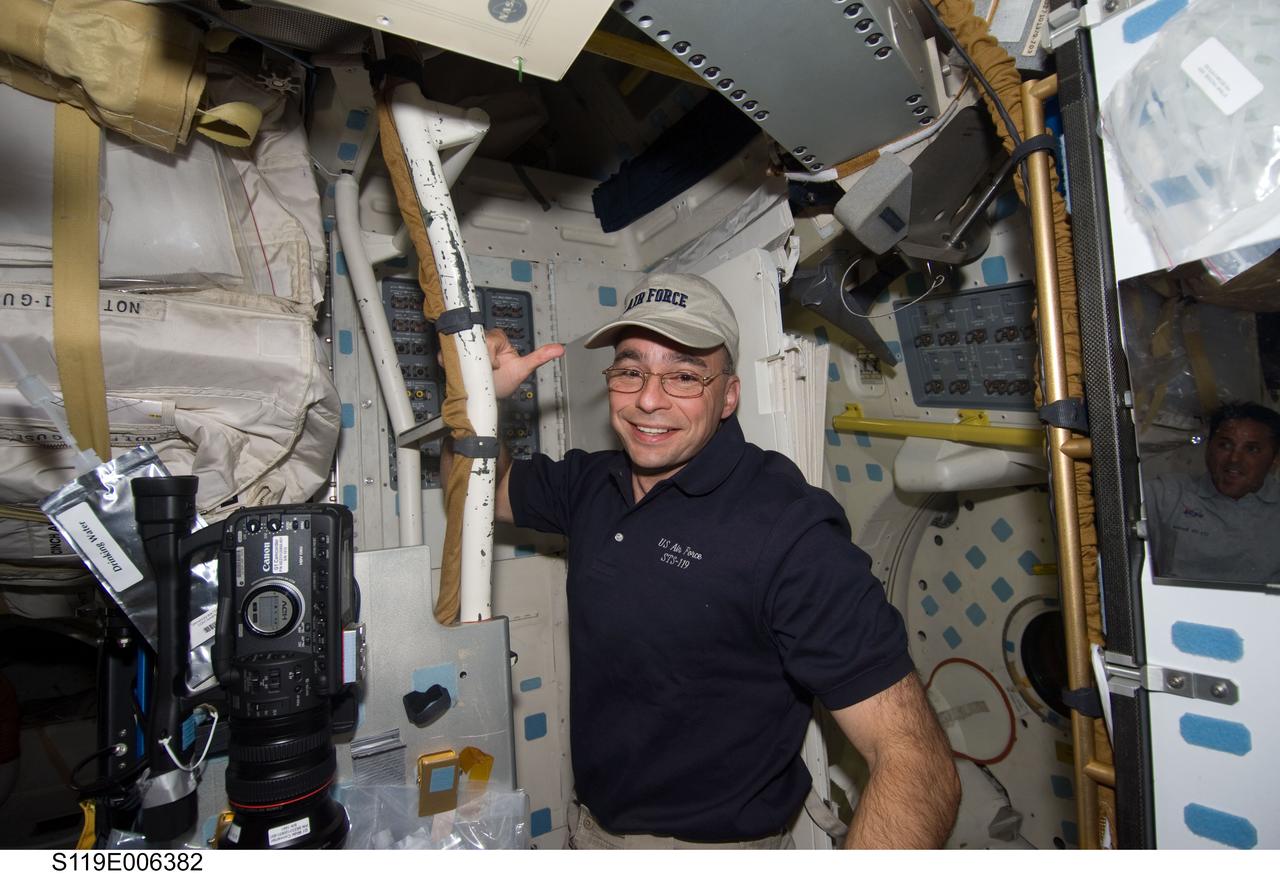 S119-E-006382 (17 March 2009) --- Astronaut Lee Archambault, STS-119 commander, is pictured on the middeck of Space Shuttle Discovery during flight day three activities.
