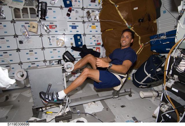 NASA image: Acaba on Mid Deck (MDDK) with Cycle Ergometer with Vibration Isolation System (CEVIS)