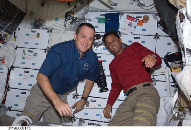 NASA image: Arnold and Acaba on Middeck (MDDK) with stowage
