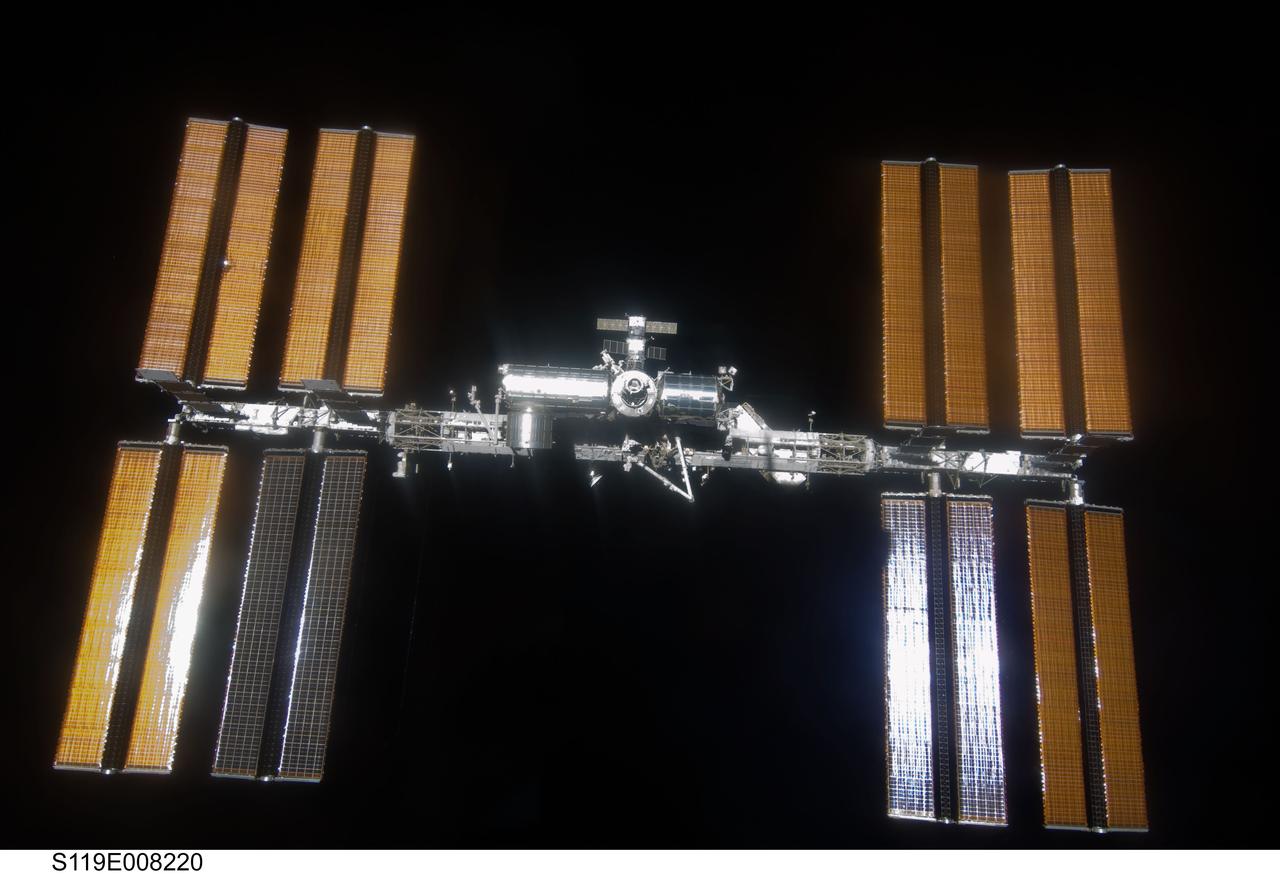 S119-E-008220 (25 March 2009) --- Backdropped by the blackness of space, the International Space Station is seen from Space Shuttle Discovery as the two spacecraft begin their relative separation. Earlier the STS-119 and Expedition 18 crews concluded 9 days, 20 hours and 10 minutes of cooperative work onboard the shuttle and station. Undocking of the two spacecraft occurred at 2:53 p.m. (CDT) on March 25, 2009.