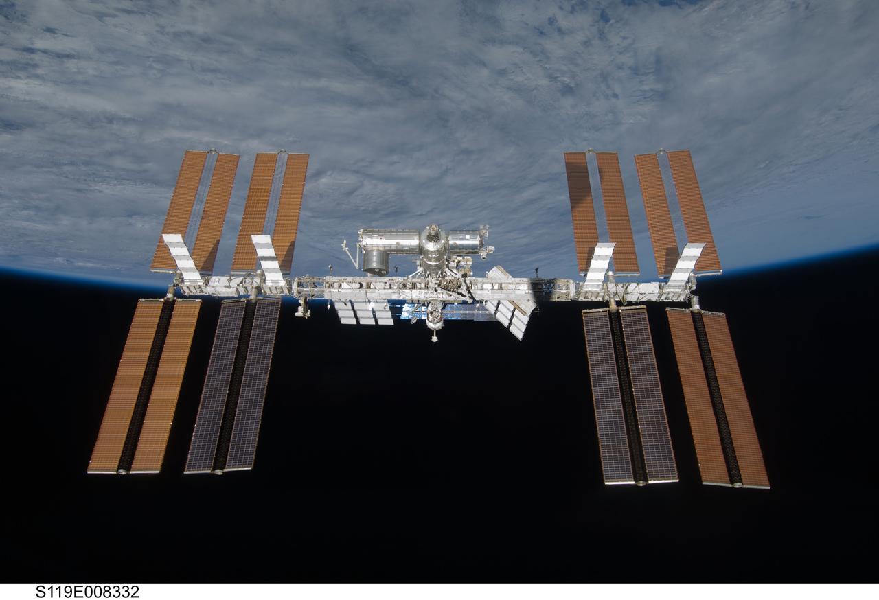 S119-E-008332 (25 March 2009) --- Backdropped by the blackness of space and Earth’s horizon, the International Space Station is seen from Space Shuttle Discovery as the two spacecraft begin their relative separation. Earlier the STS-119 and Expedition 18 crews concluded 9 days, 20 hours and 10 minutes of cooperative work onboard the shuttle and station. Undocking of the two spacecraft occurred at 2:53 p.m. (CDT) on March 25, 2009.