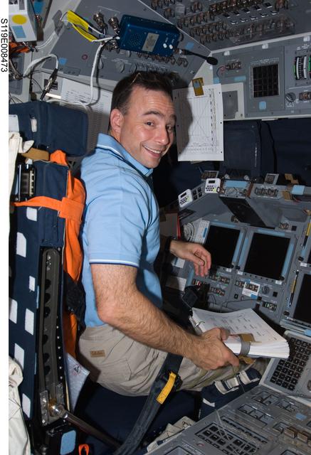 NASA image: Archambault seated on Flight Deck (FD) with timeline