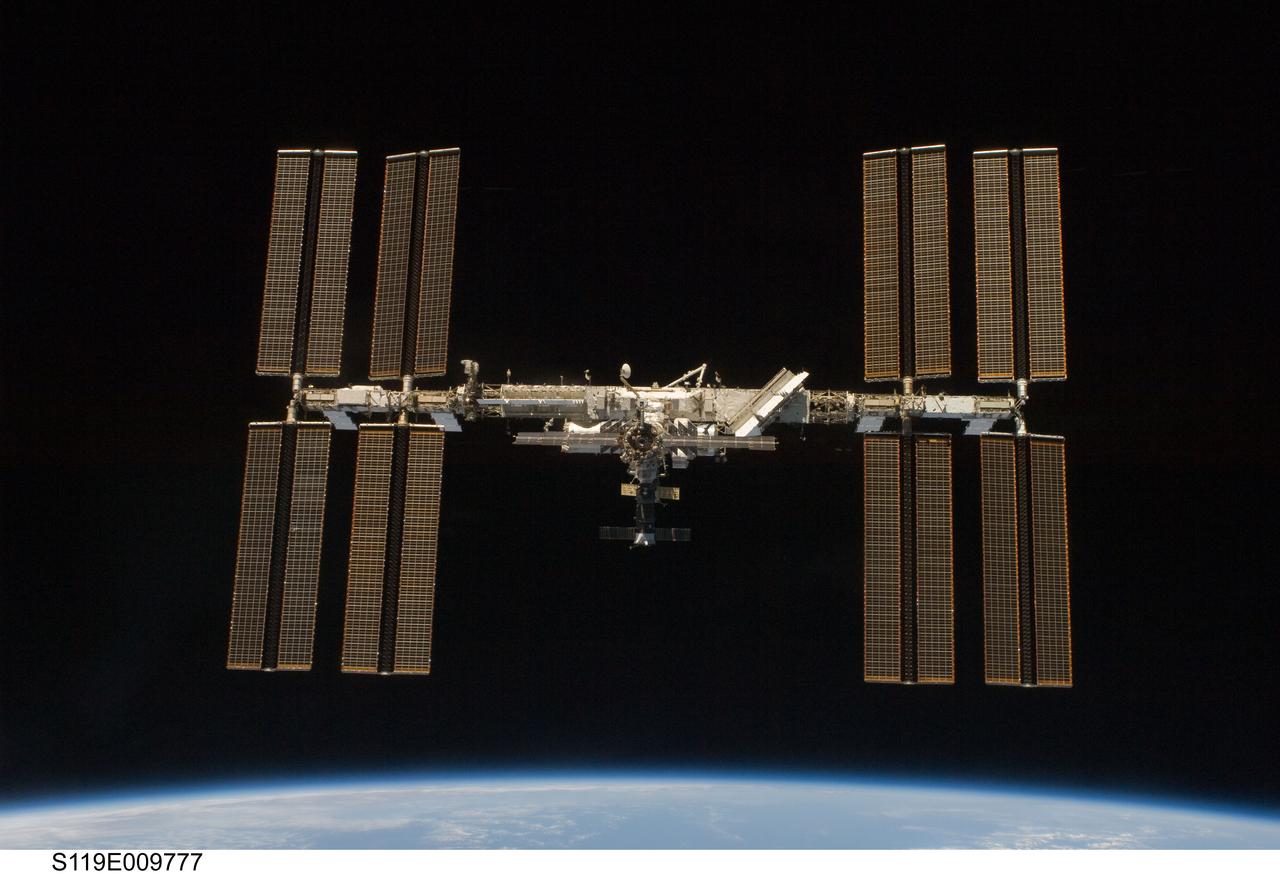 S119-E-009777 (25 March 2009) --- Backdropped by the blackness of space and Earth?s horizon, the International Space Station is seen from Space Shuttle Discovery as the two spacecraft begin their relative separation. Earlier the STS-119 and Expedition 18 crews concluded 9 days, 20 hours and 10 minutes of cooperative work onboard the shuttle and station. Undocking of the two spacecraft occurred at 2:53 p.m. (CDT) on March 25, 2009.