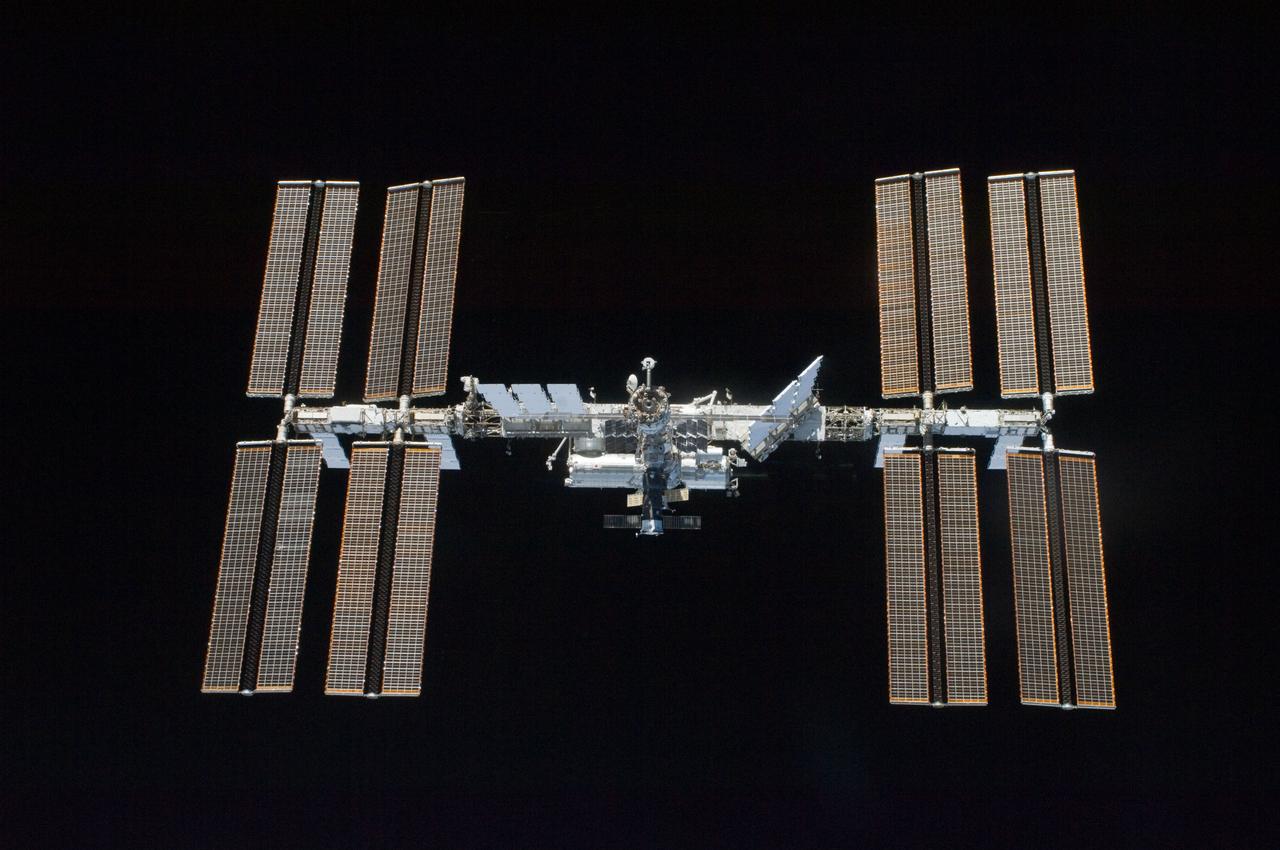 S119-E-009793 (25 March 2009) --- Backdropped by the blackness of space, the International Space Station is seen from Space Shuttle Discovery as the two spacecraft begin their relative separation. Earlier the STS-119 and Expedition 18 crews concluded 9 days, 20 hours and 10 minutes of cooperative work onboard the shuttle and station. Undocking of the two spacecraft occurred at 2:53 p.m. (CDT) on March 25, 2009.