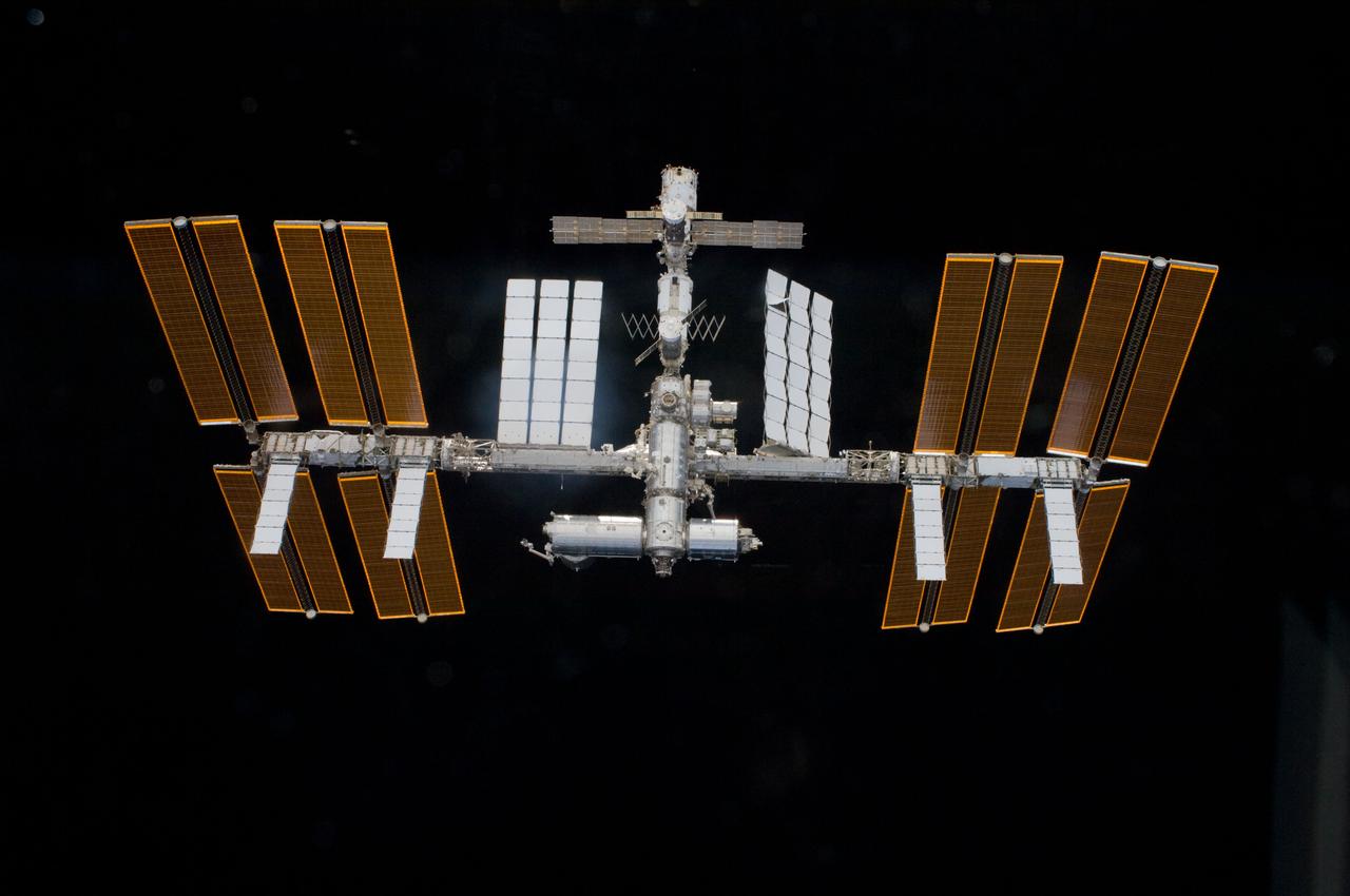 S119-E-009958 (25 March 2009) --- Backdropped by the blackness of space, the International Space Station is seen from Space Shuttle Discovery as the two spacecraft begin their relative separation. Earlier the STS-119 and Expedition 18 crews concluded 9 days, 20 hours and 10 minutes of cooperative work onboard the shuttle and station. Undocking of the two spacecraft occurred at 2:53 p.m. (CDT) on March 25, 2009.