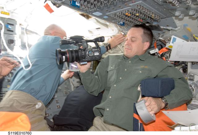 NASA image: Arnold with video camera on Flight Deck (FD)