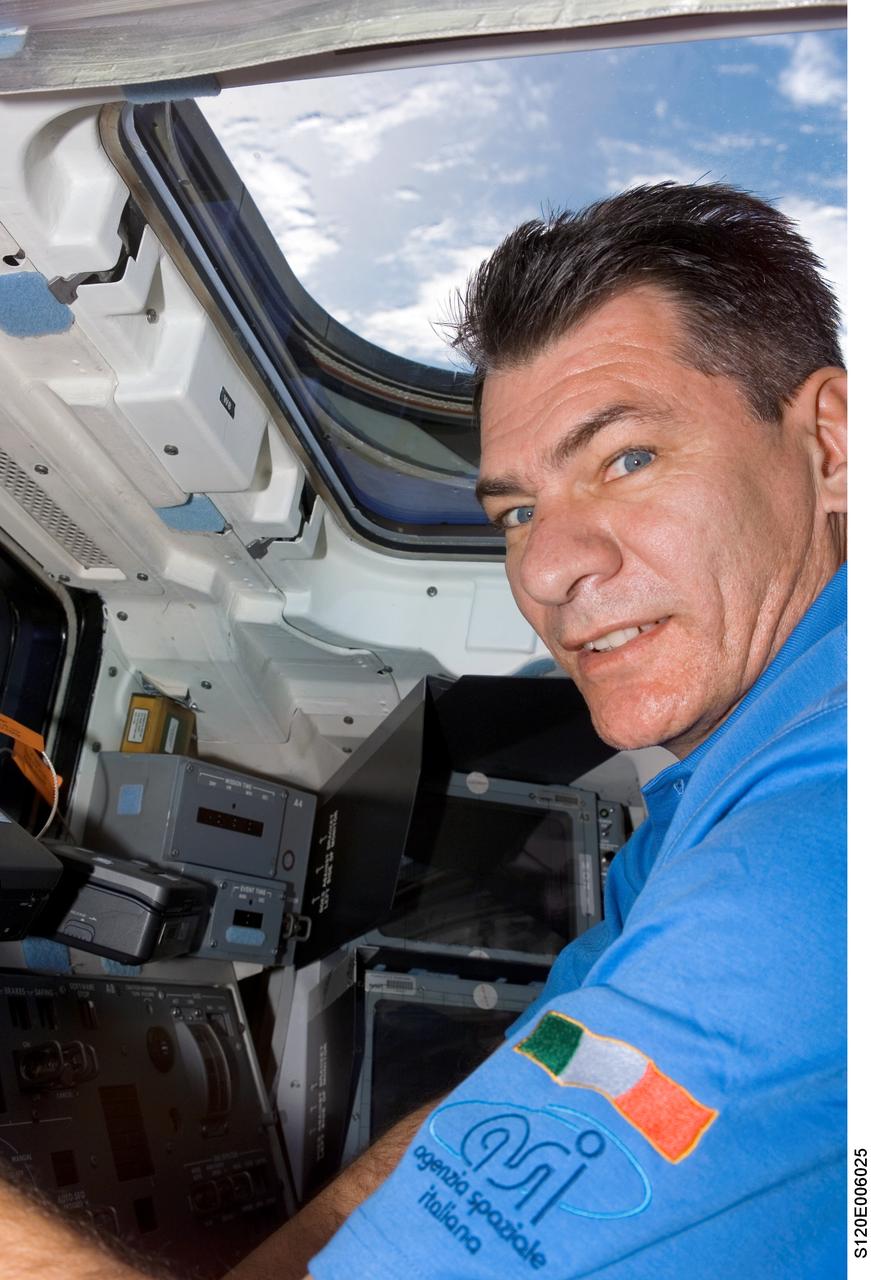 S120-E-006025 (24 Oct. 2007) --- European Space Agency (ESA) astronaut Paolo Nespoli, STS-120 mission specialist, photographed on the aft flight deck of Space Shuttle Discovery during flight day two activities.