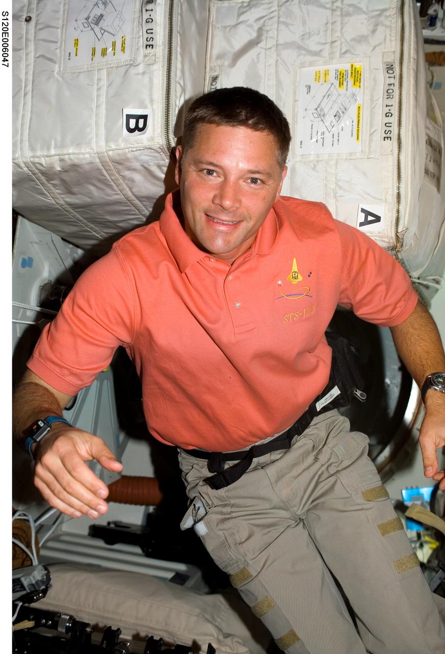 S120-E-006047 (24 Oct. 2007) --- Astronaut Doug Wheelock, STS-120 mission specialist, photographed on the middeck of Space Shuttle Discovery during flight day two activities.