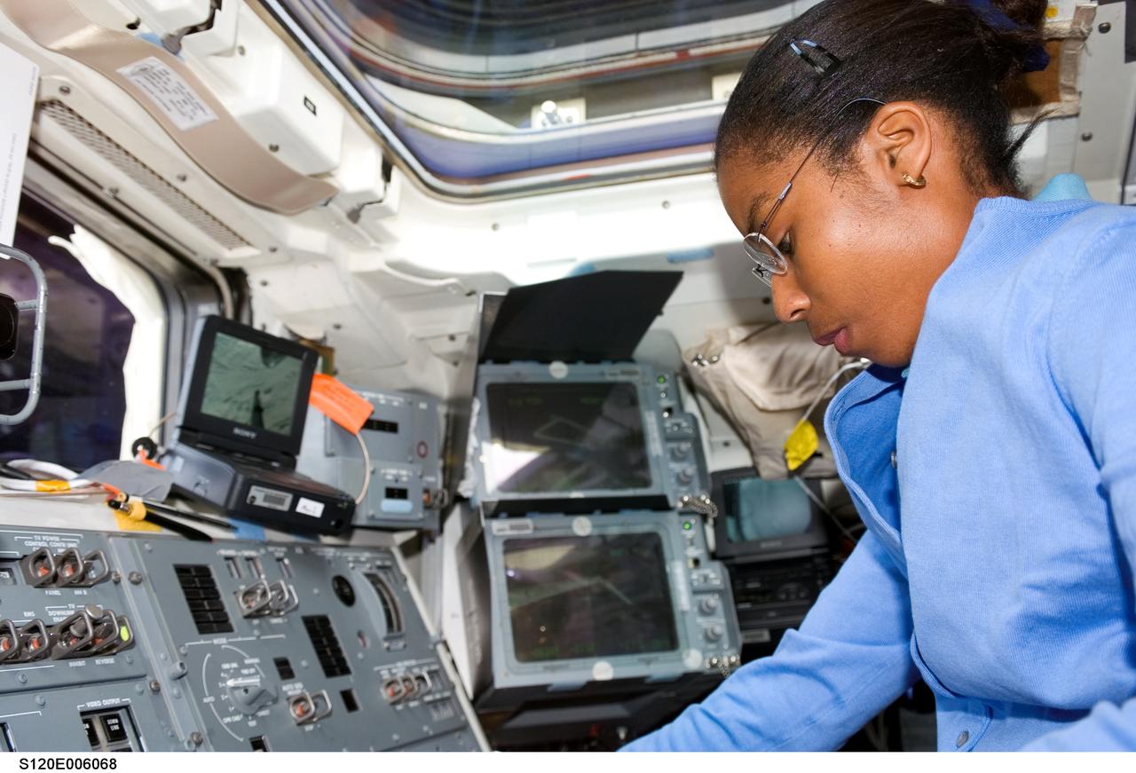 S120-E-006068 (24 Oct. 2007) --- Astronaut Stephanie Wilson, STS-120 mission specialist, photographed on the aft flight deck of Space Shuttle Discovery during flight day two activities.