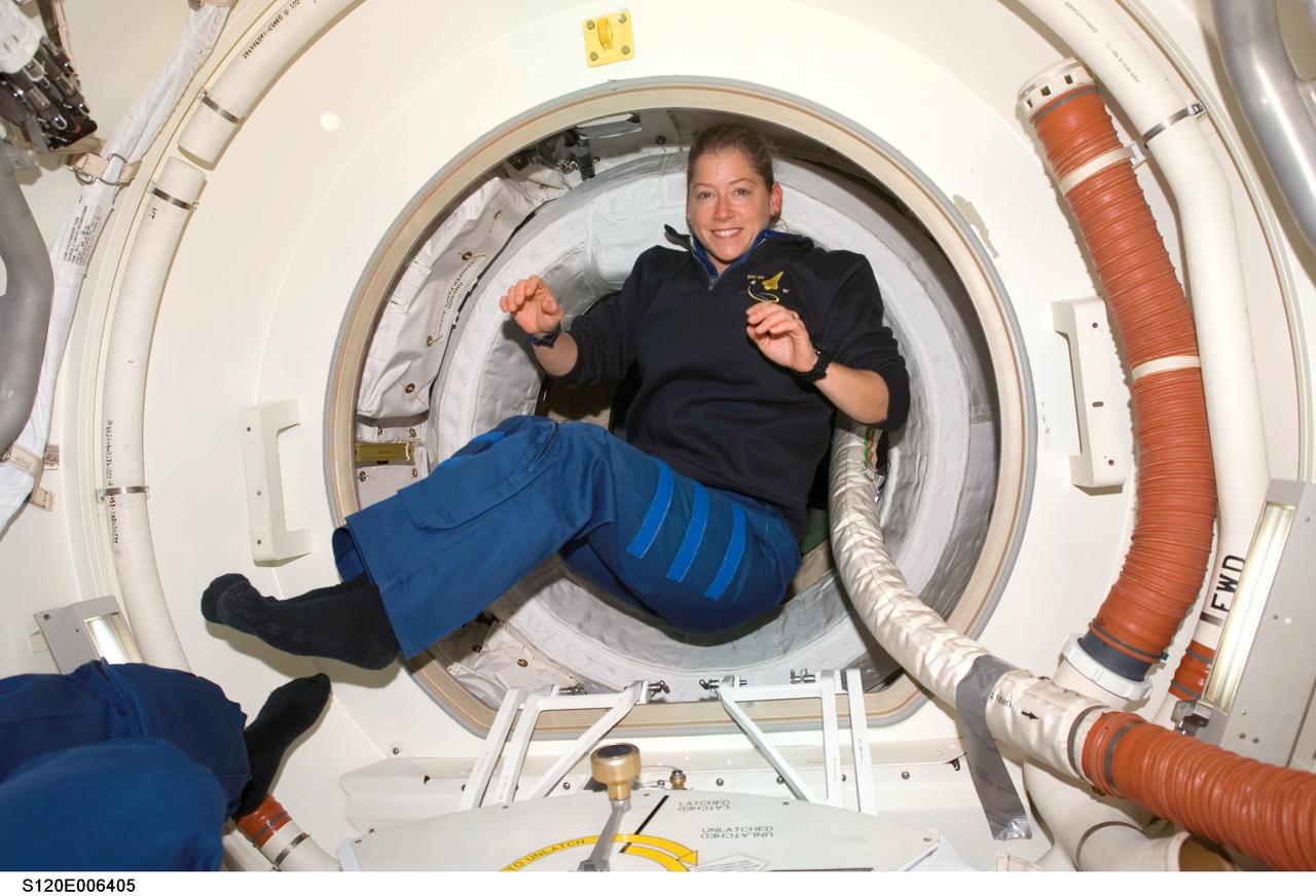 S120-E-006405 (25 Oct. 2007) --- Astronaut Pam Melroy, STS-120 commander, floats in the Orbiter Docking Compartment (ODS) after hatch opening between the International Space Station and Space Shuttle Discovery.