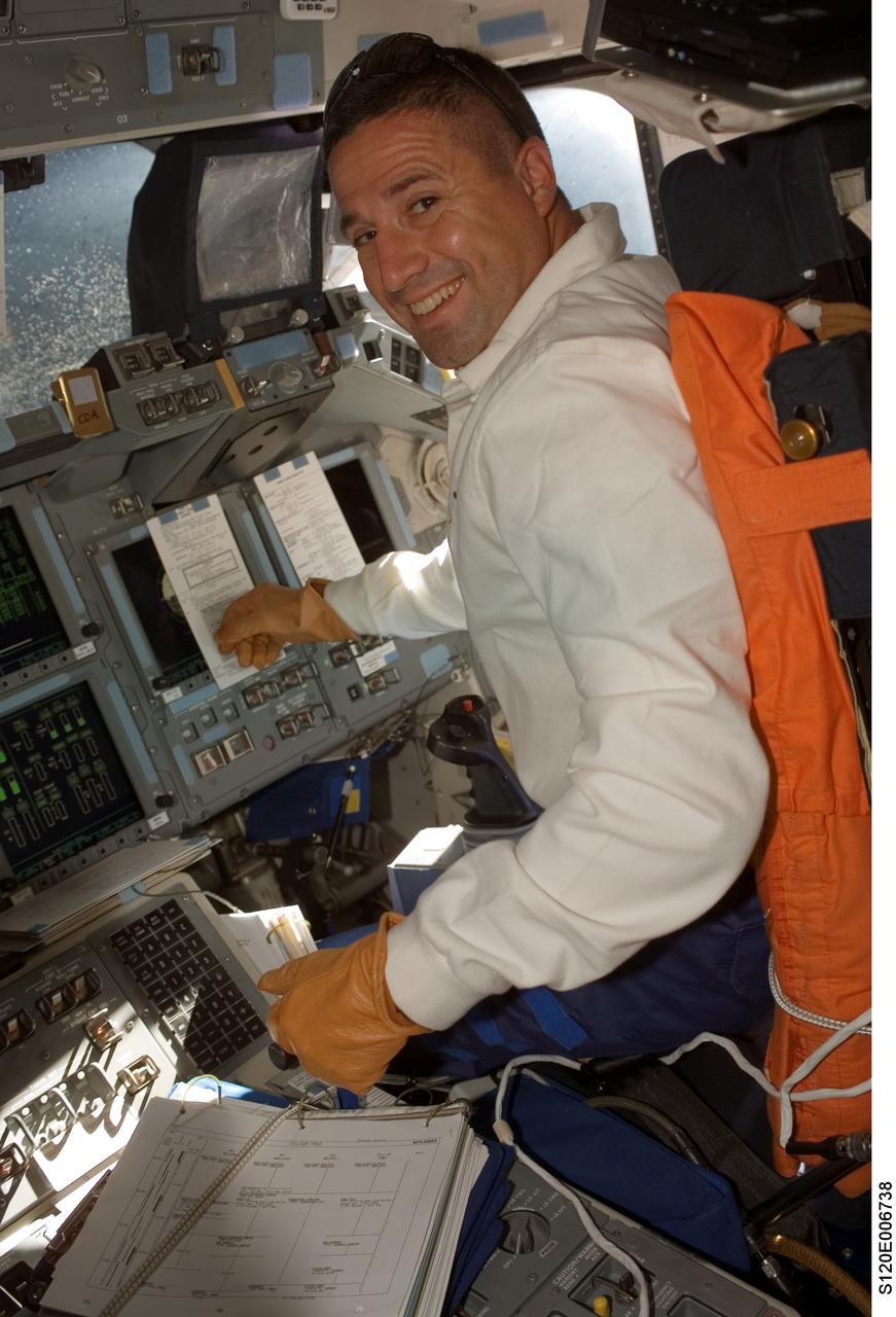S120-E-006738 (25 Oct. 2007) --- Astronaut George Zamka, STS-120 pilot, seated at the pilot's station on the forward flight deck of the Space Shuttle Discovery during rendezvous and docking operations.