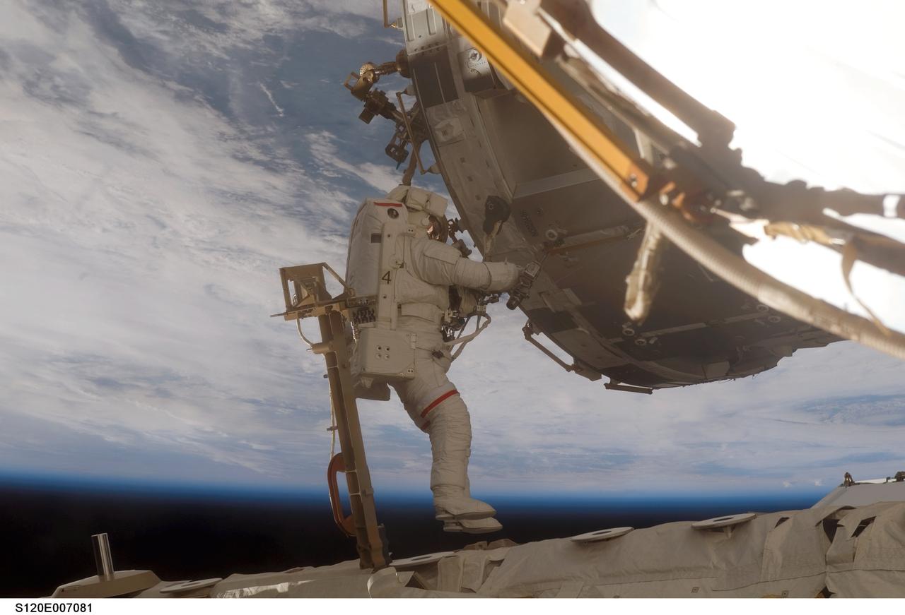 S120-E-007081 (28 Oct. 2007) --- Astronaut Scott Parazynski, STS-120 mission specialist, participates in the second of five scheduled sessions of extravehicular activity (EVA) as construction continues on the International Space Station. During the 6-hour, 33-minute spacewalk Parazynski and astronaut Daniel Tani (out of frame), Expedition 16 flight engineer, worked in tandem to disconnect cables from the P6 truss, allowing it to be removed from the Z1 truss. Tani also visually inspected the station's starboard Solar Alpha Rotary Joint (SARJ) and gathered samples of "shavings" he found under the joint's multi-layer insulation covers. Also the spacewalkers outfitted the Harmony module, mated the power and data grapple fixture and reconfigured connectors on the starboard 1 (S1) truss that will allow the radiator on S1 to be deployed from the ground later.